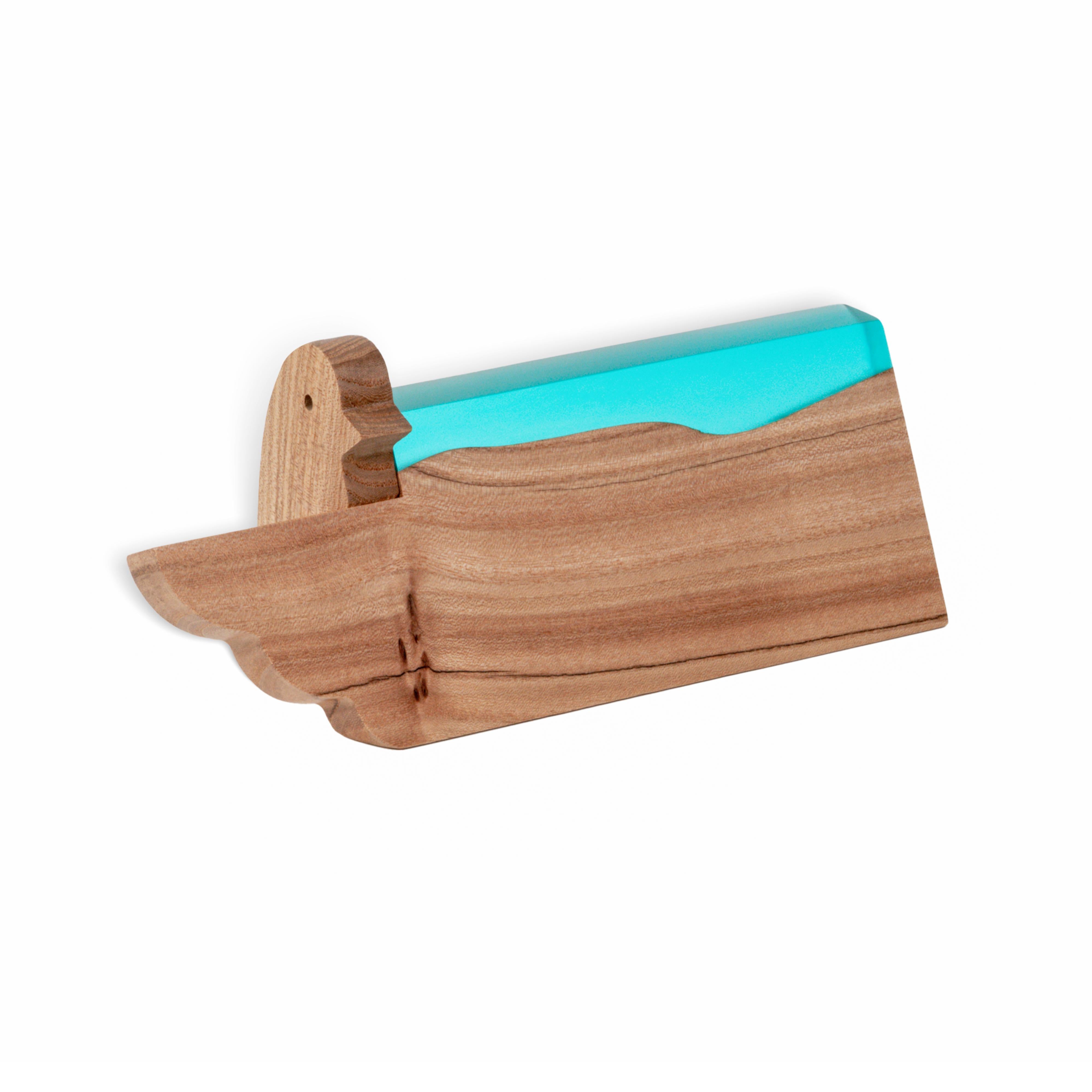 Close-up of the personalized BIRDY desk name plate made from elm wood and aqua blue epoxy resin