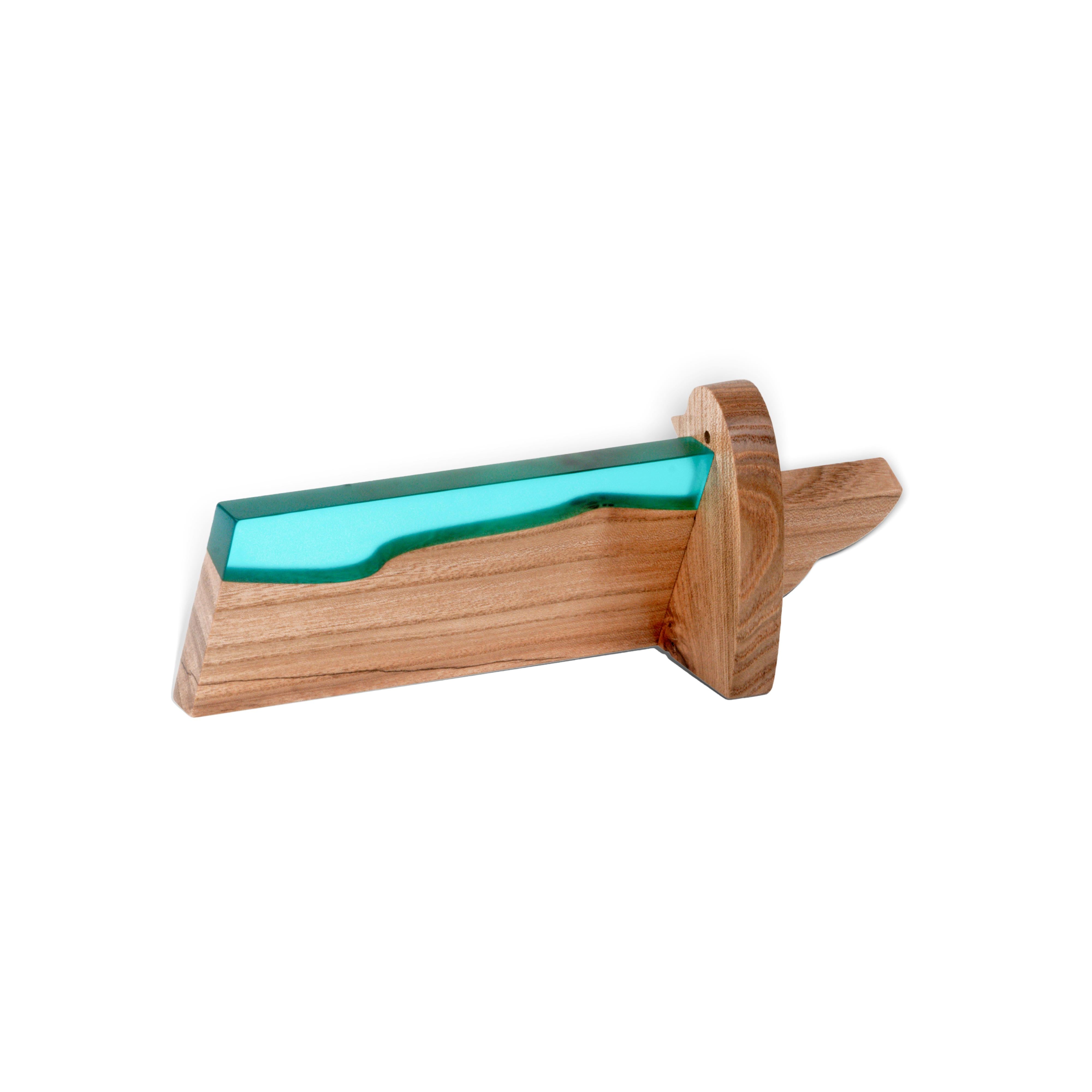 Detail view of the personalized BIRDY desk name plate handcrafted from elm wood and aqua blue epoxy resin