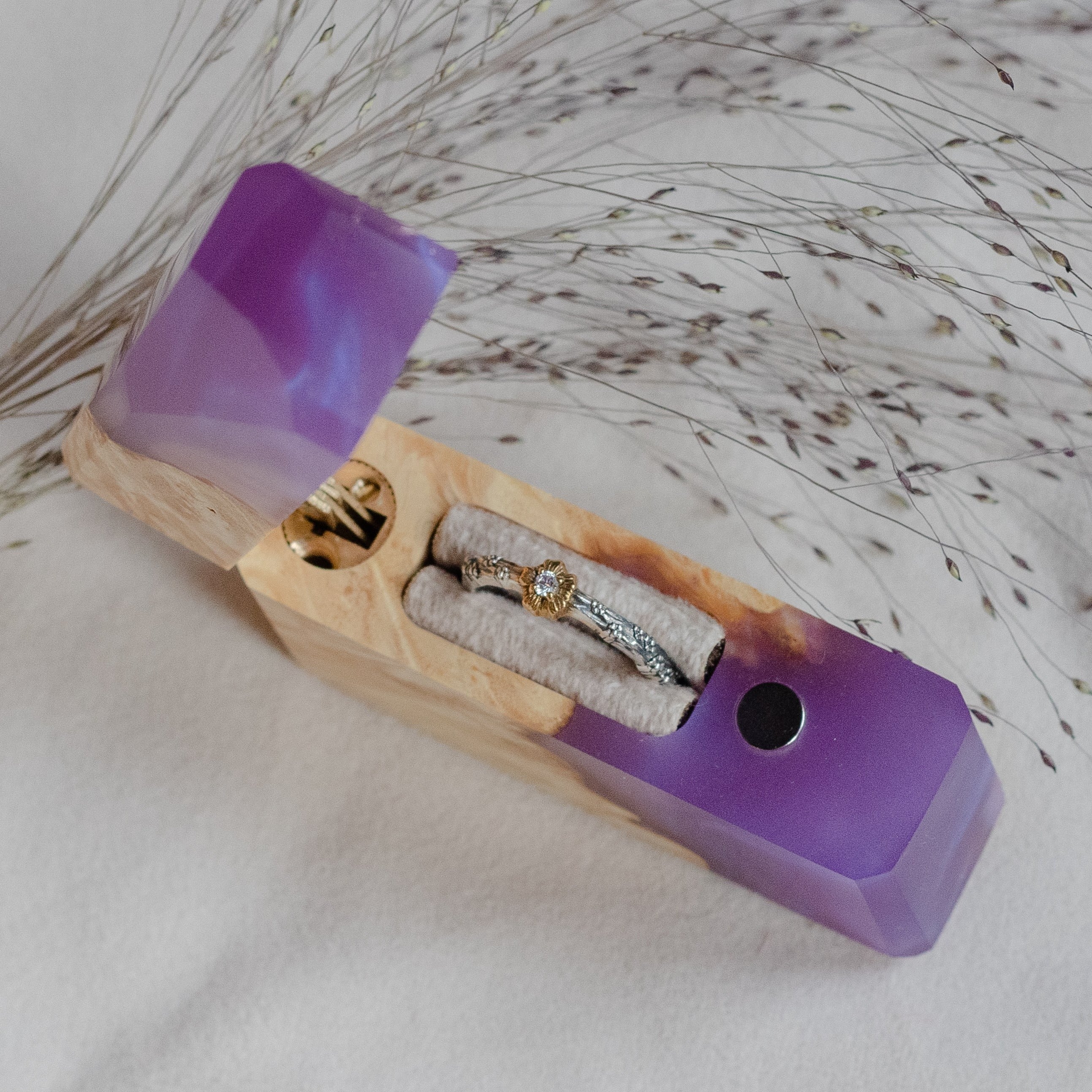 Elegant open purple epoxy and maple wood engagement ring box with the ring compartment visible