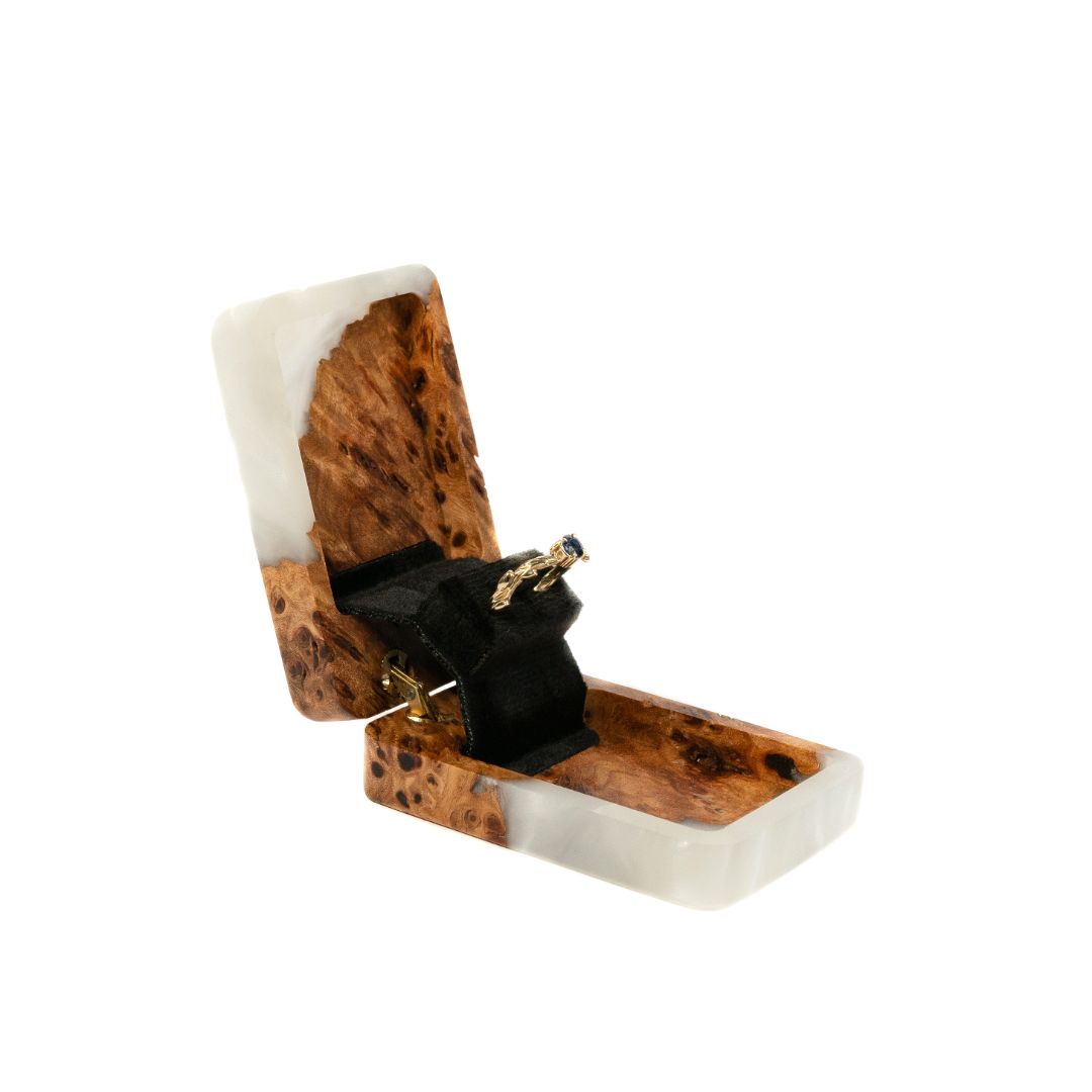 Elegant platinum epoxy and elm wood proposal ring box opened to display the ring compartment
