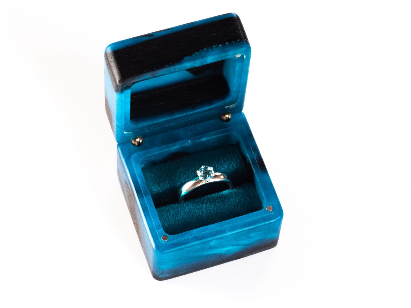 Handcrafted blue epoxy and bog oak wood engagement ring box with the ring holder clearly visible