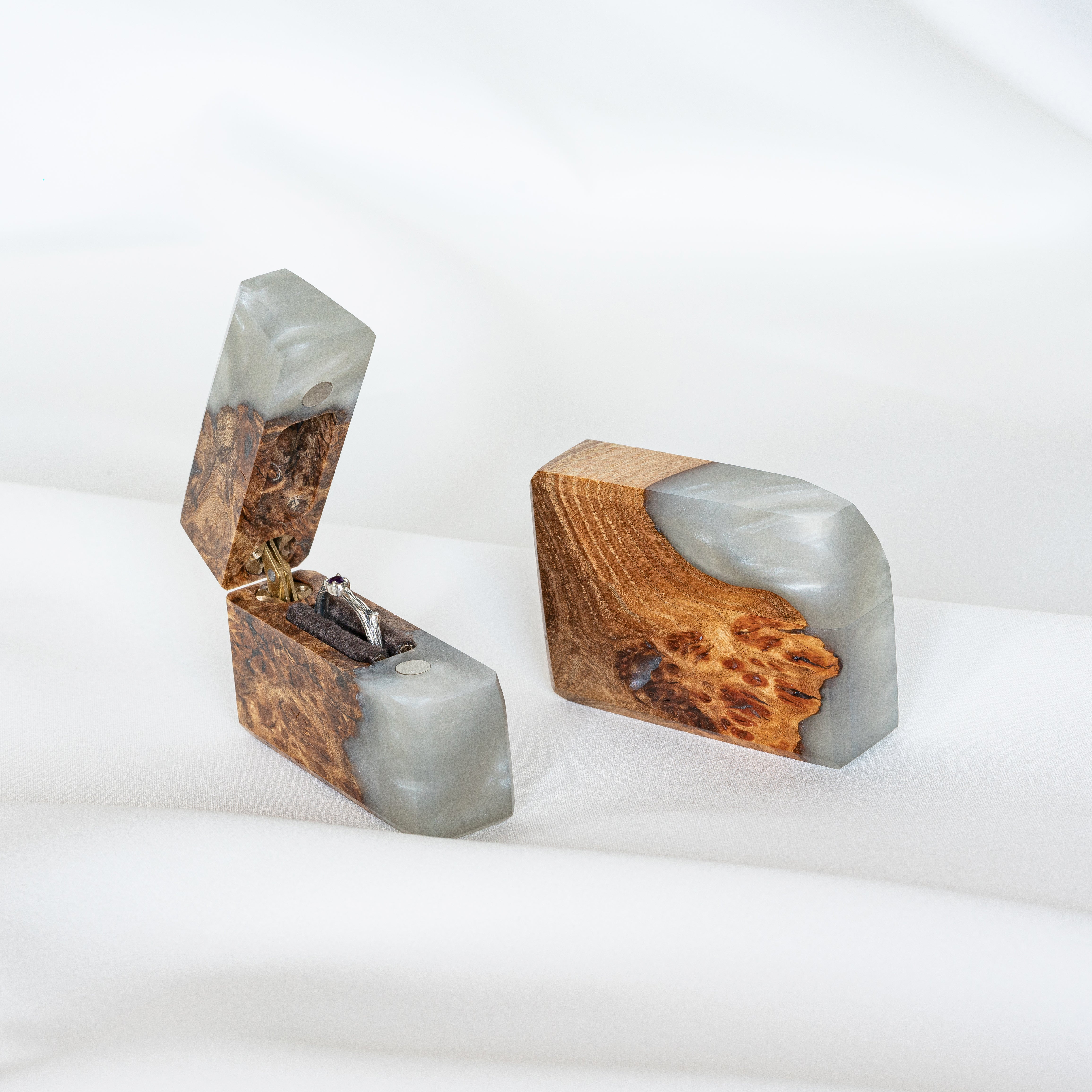 Handcrafted platinum epoxy and elm wood engagement ring box displayed open with the matching closed box