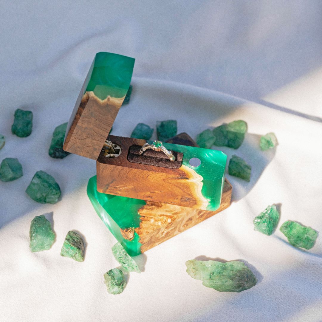 Handcrafted green epoxy and elm wood proposal ring box surrounded by decorative green crystals