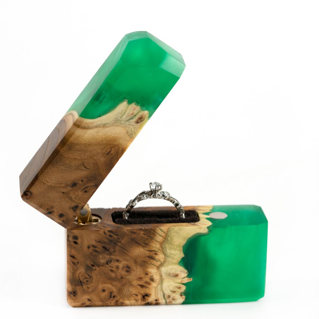 Modern proposal ring box featuring translucent green epoxy and solid elm wood