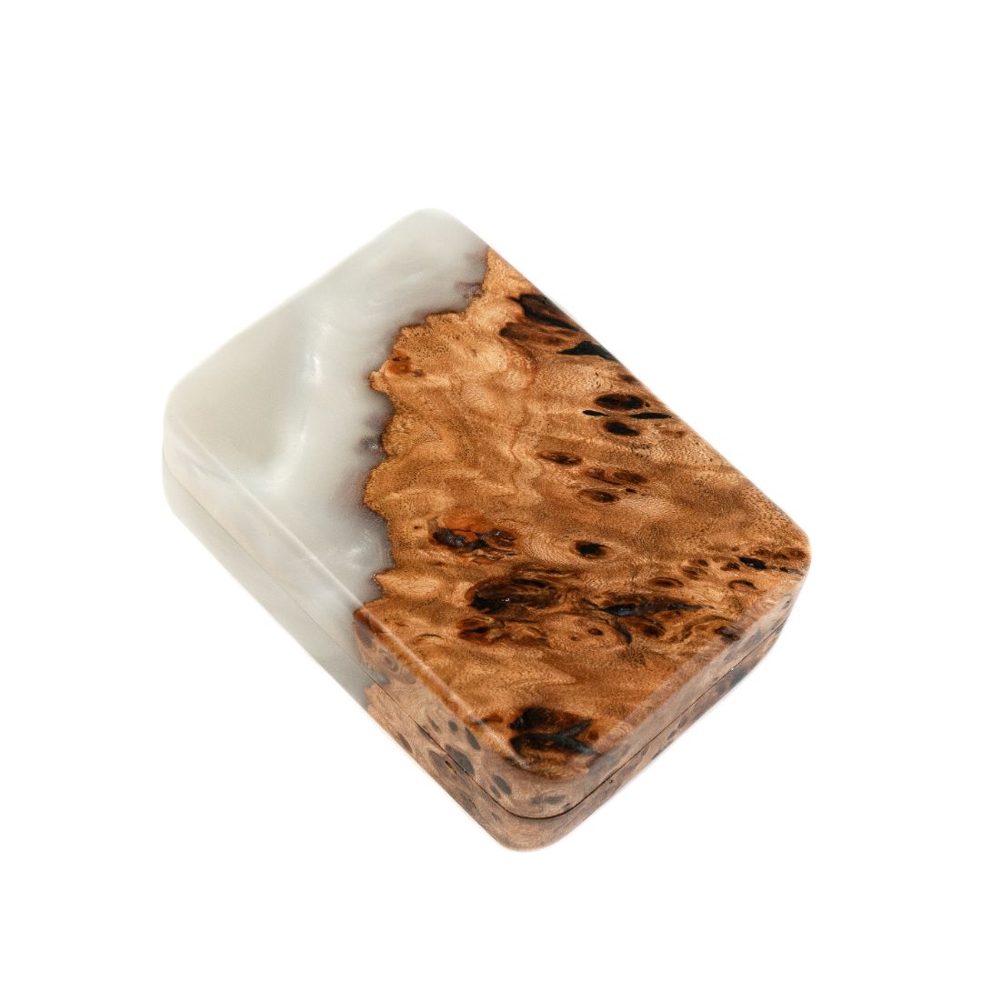 Close-up of the natural elm wood grain and platinum epoxy on the FLIP proposal ring box