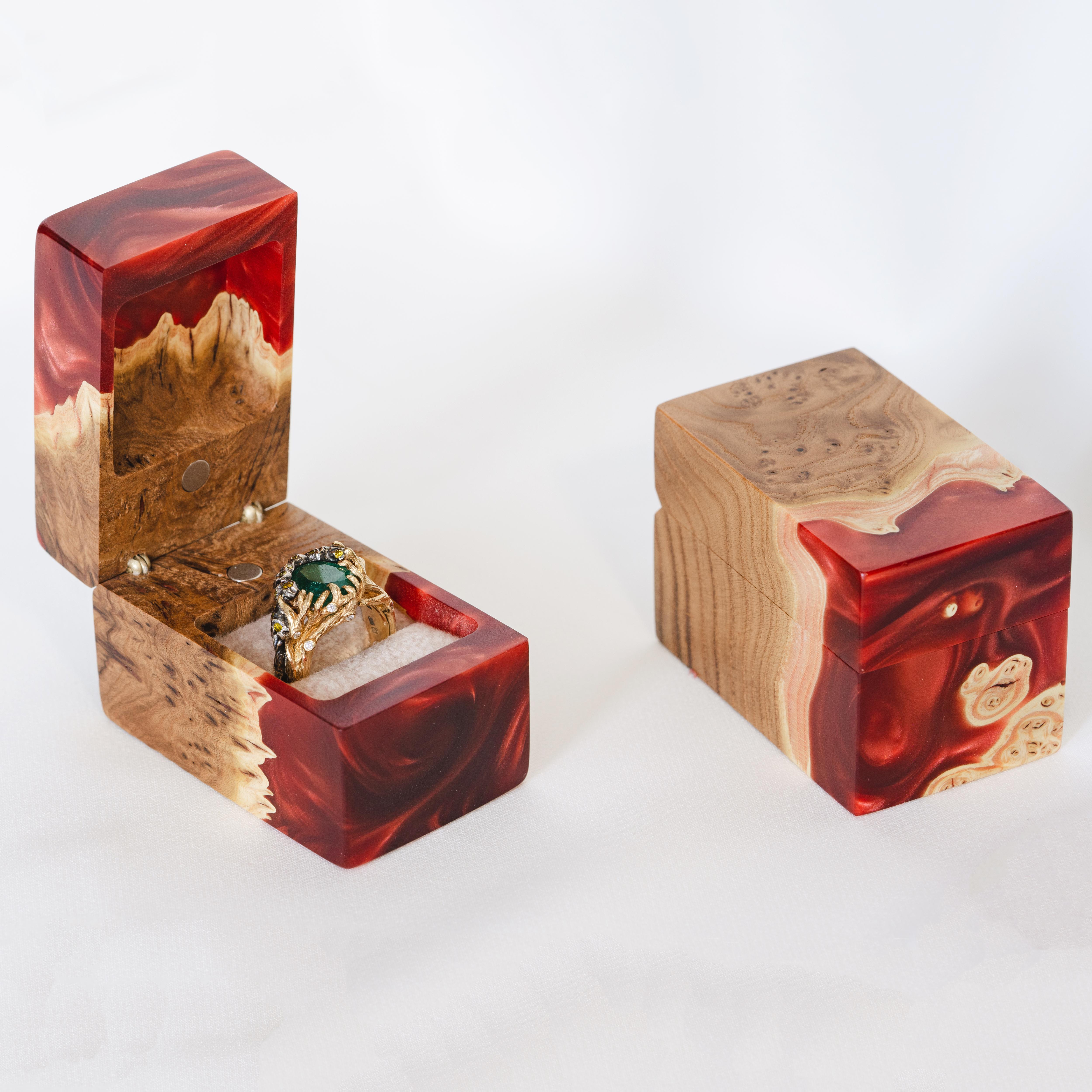 Open engagement ring box handcrafted from ruby epoxy and elm wood with the matching closed box beside it