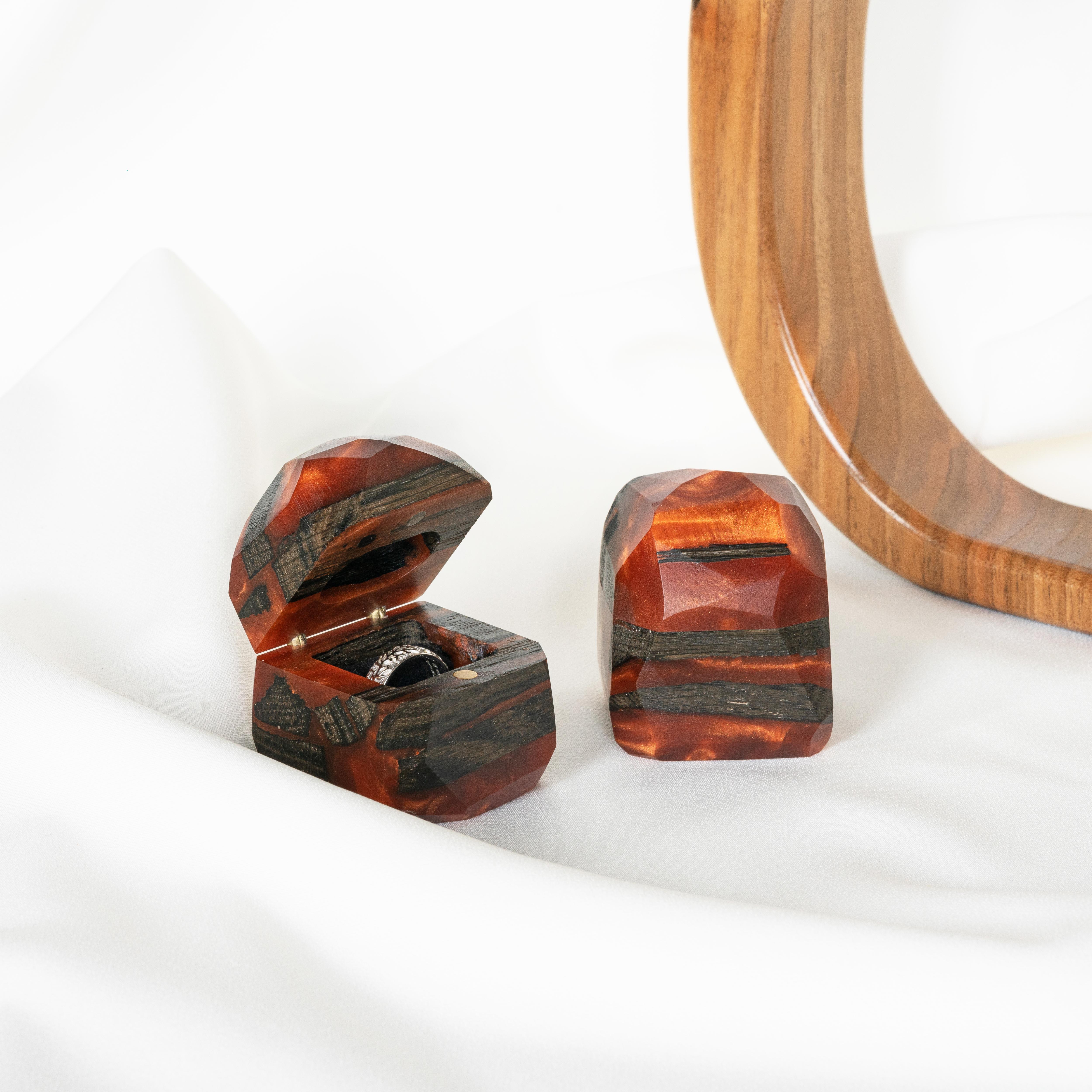 Open proposal ring box handcrafted from amber epoxy and bog oak wood with the matching closed box beside it