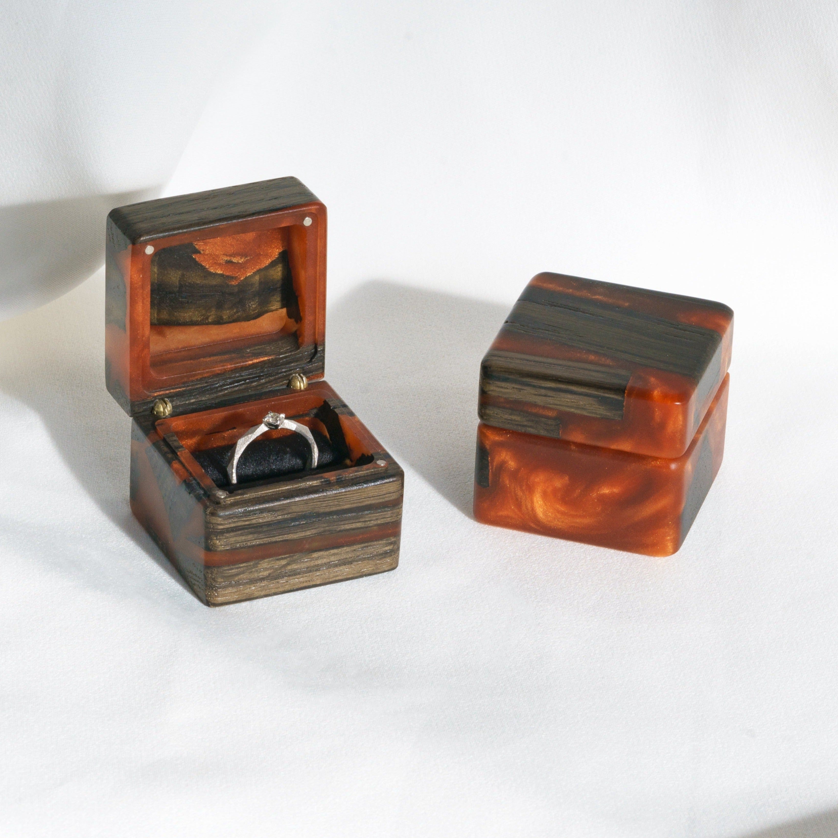 Open proposal ring box handcrafted from amber epoxy and bog oak wood with matching closed box, MUSE design