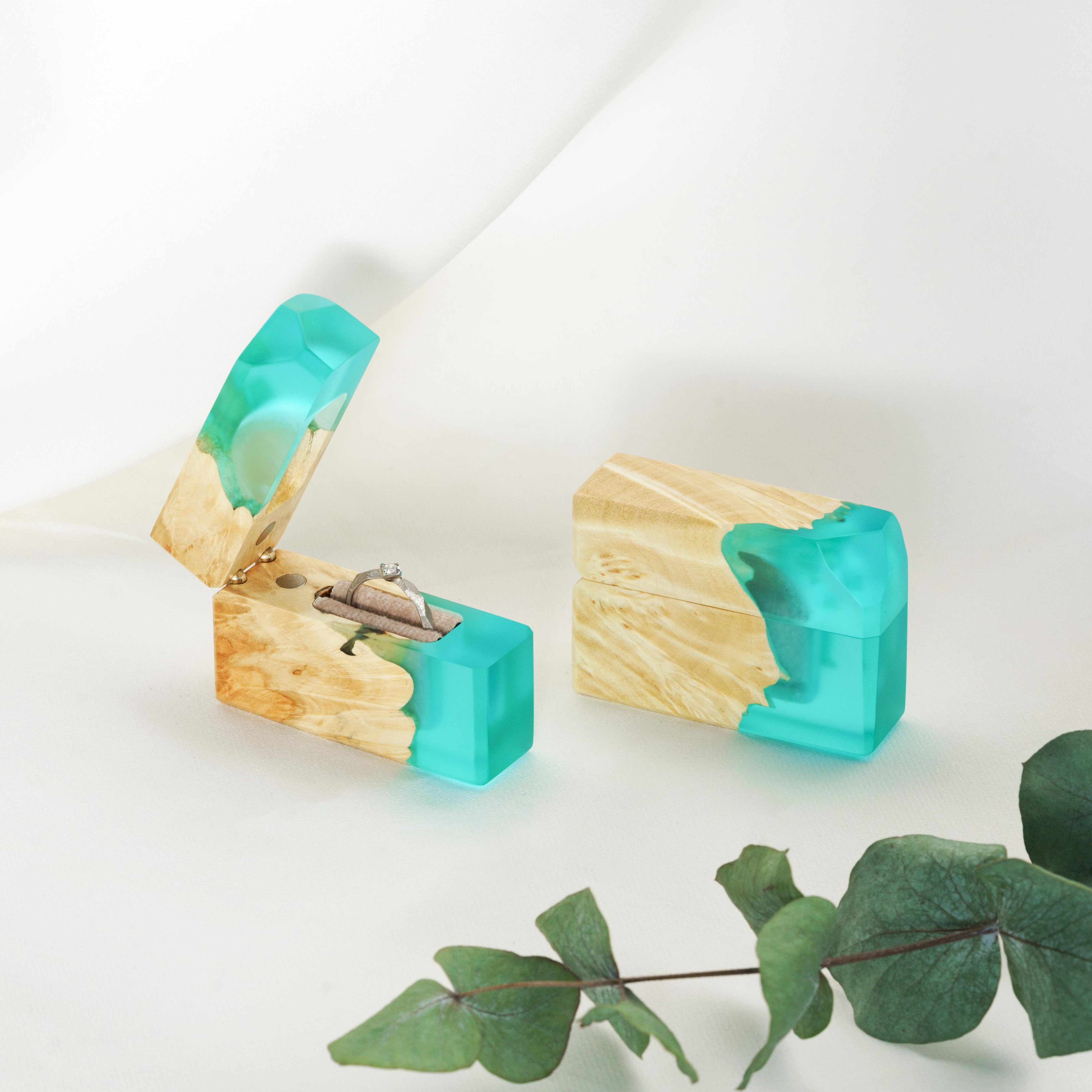 Open proposal ring box handcrafted from aqua blue epoxy and maple wood with the matching closed box beside it