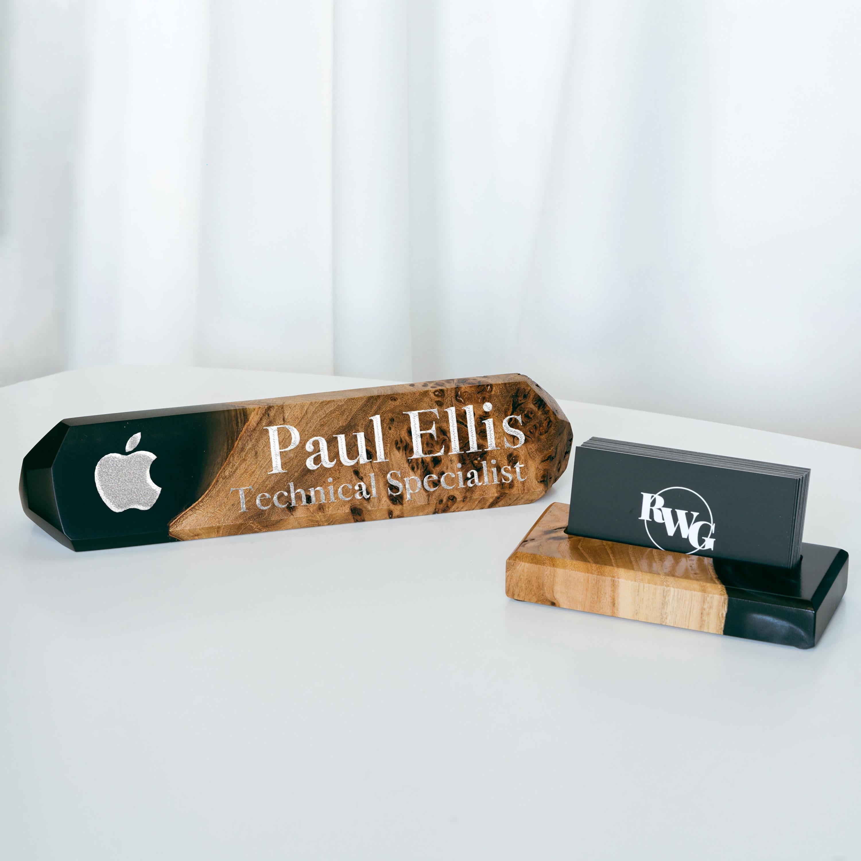 ersonalized desk name plate made from burl wood and black epoxy resin displayed in a modern office setting