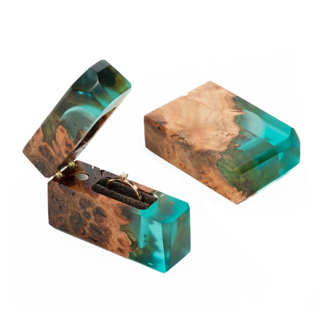 Open and closed aqua blue epoxy and maple wood engagement ring box displayed together