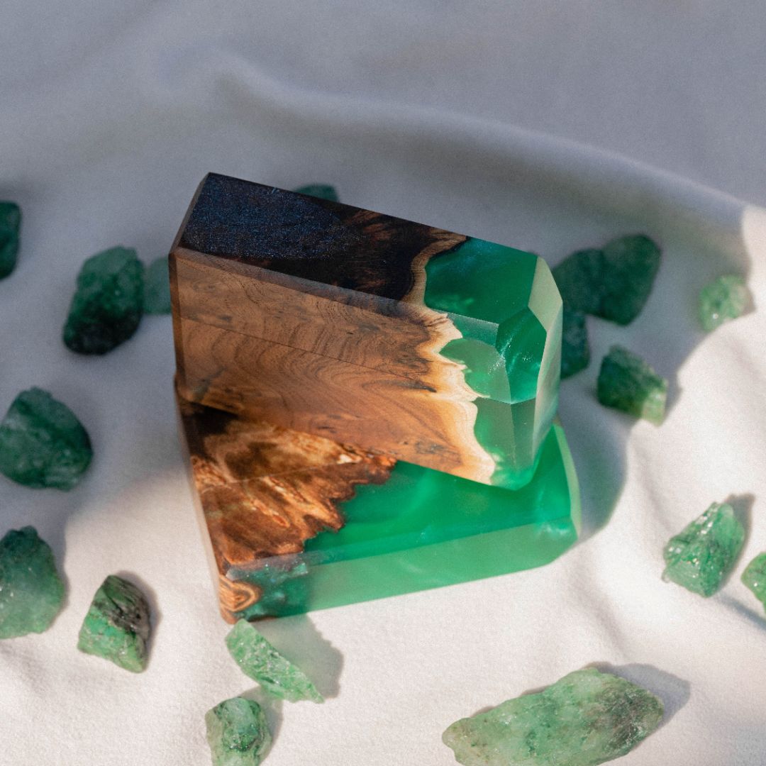 Premium green epoxy and elm wood proposal ring box photographed with gemstone accents