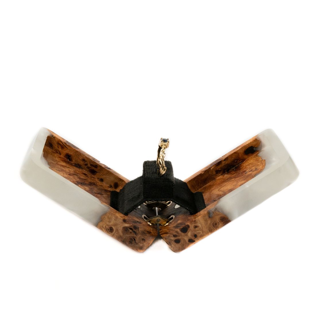 Top view of the open platinum epoxy and elm wood proposal ring box with ring holder visible