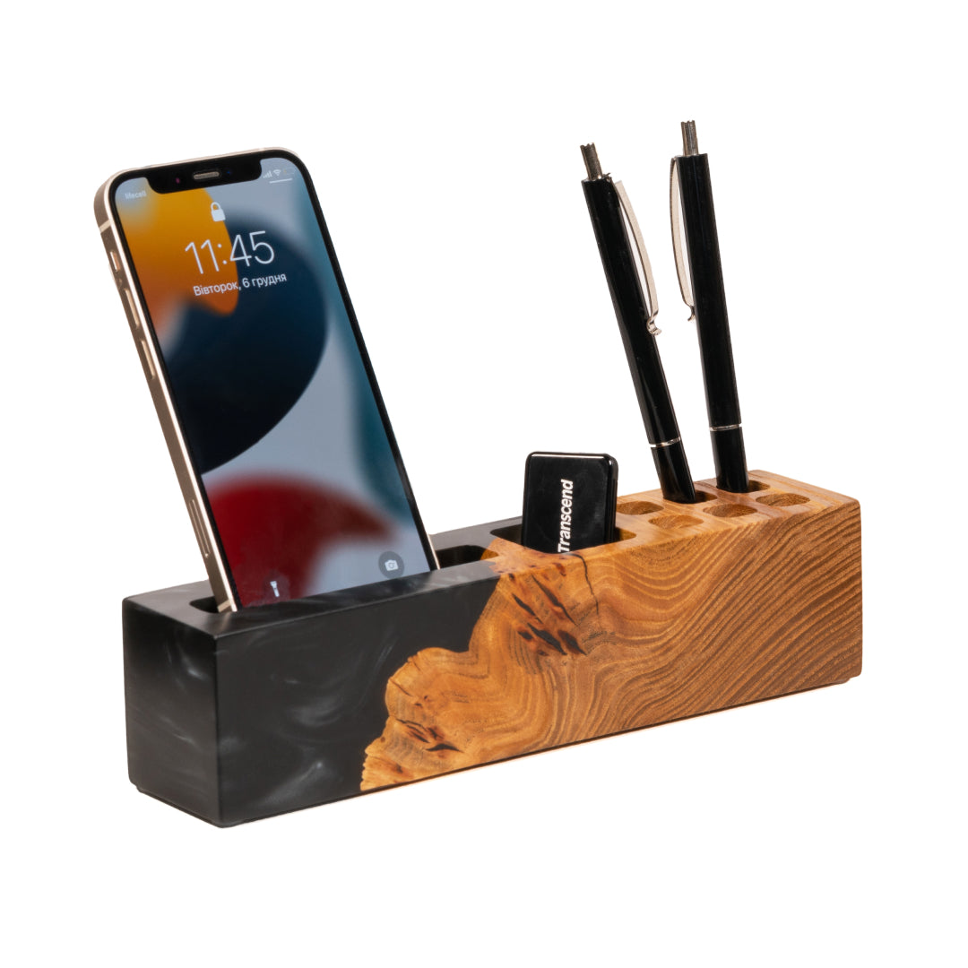 ELEMENT wooden desk organizer with phone stand holding a smartphone and pens, handcrafted from elm wood and black epoxy resin