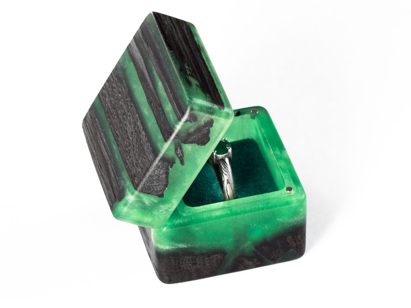 Angled side view of the open green epoxy and bog oak wood engagement ring box