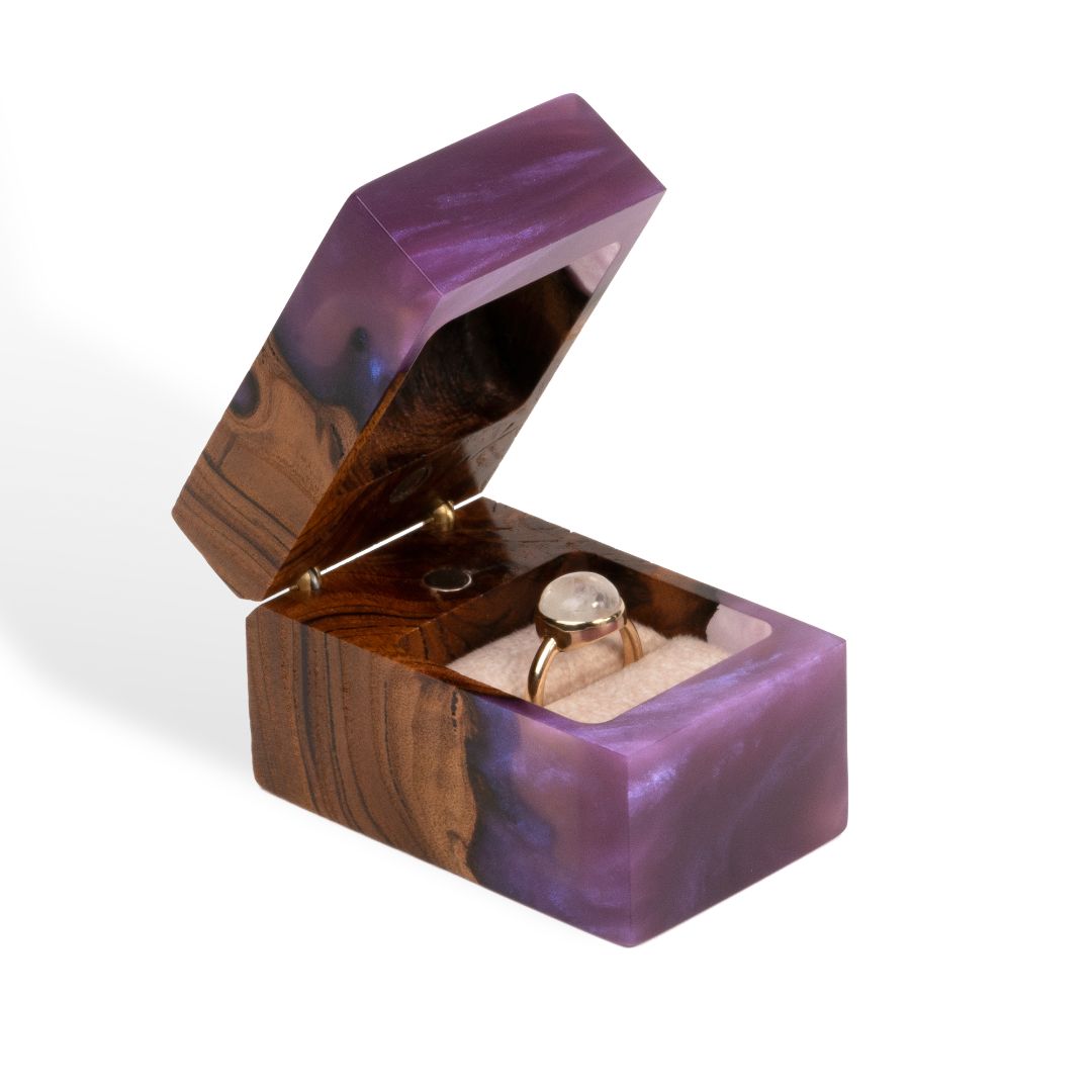 Elegant open purple epoxy and elm wood engagement ring box with the ring holder visible