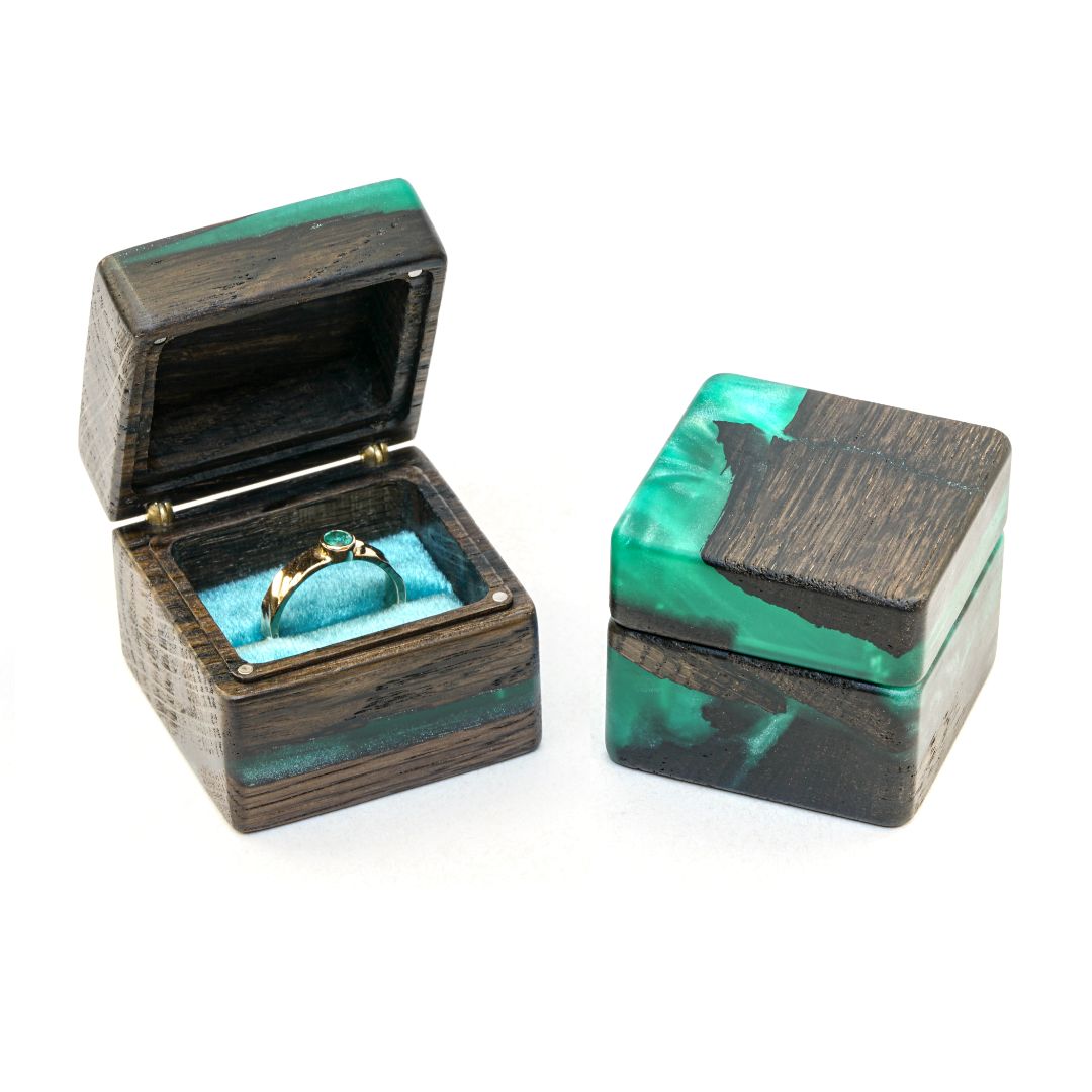 Open and closed green epoxy and bog oak wood engagement ring box displayed together