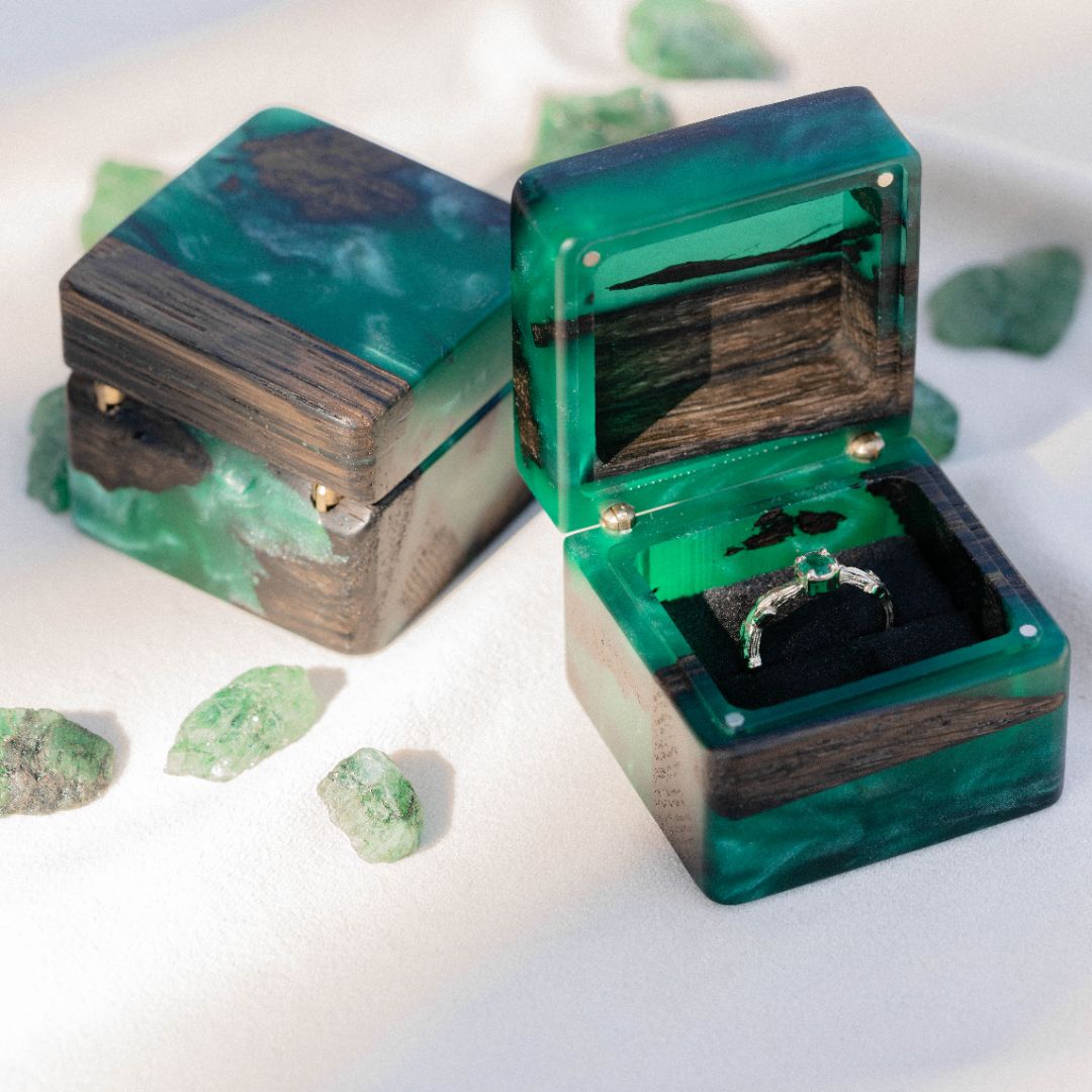 Handcrafted green epoxy and bog oak wood engagement ring box with open lid and ring compartment
