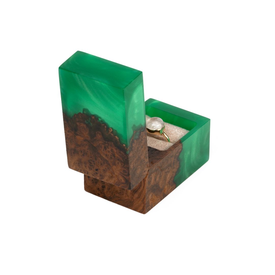 Handcrafted green epoxy and elm wood proposal ring box photographed from a front angle