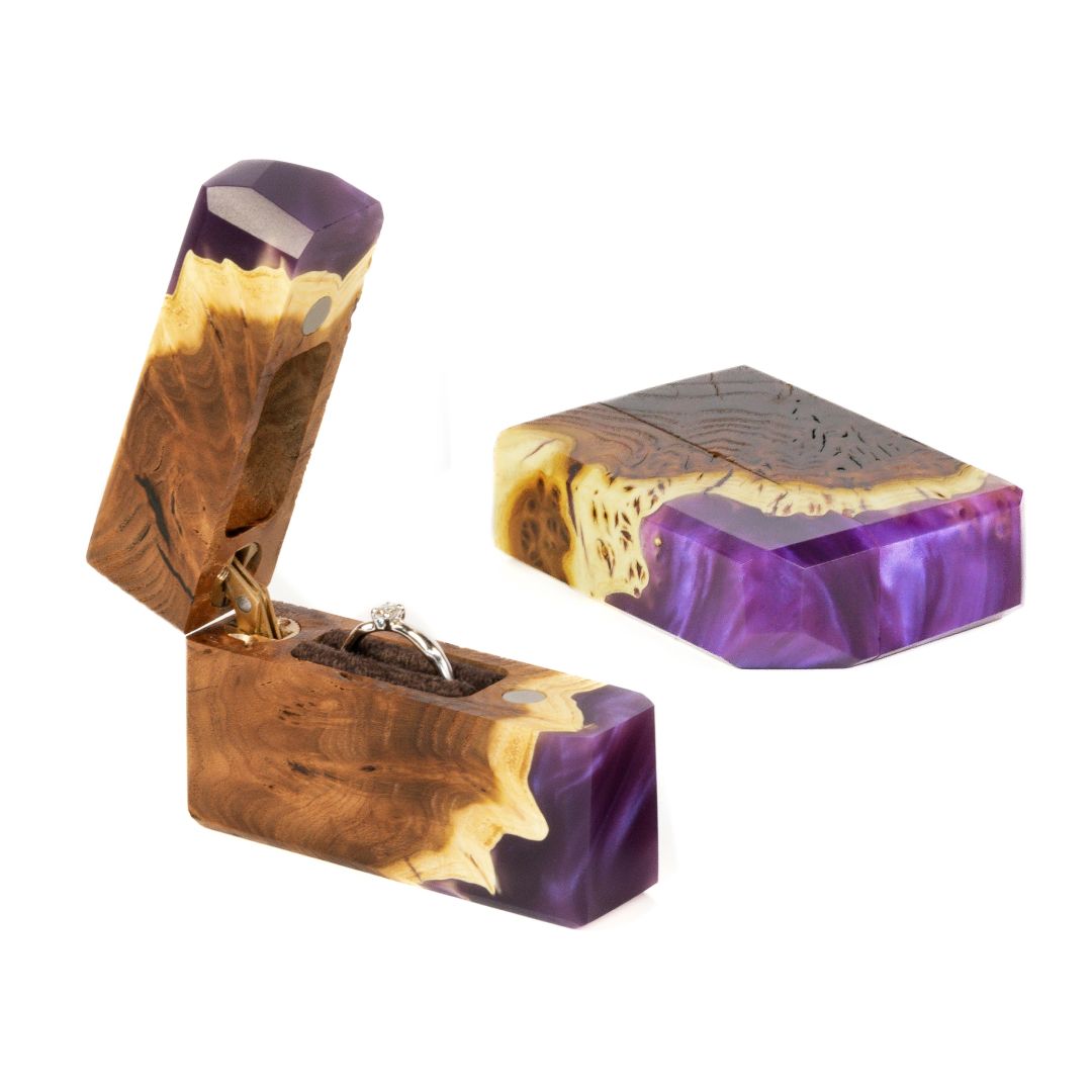 Handcrafted purple epoxy and elm wood proposal ring box photographed from an angled front view