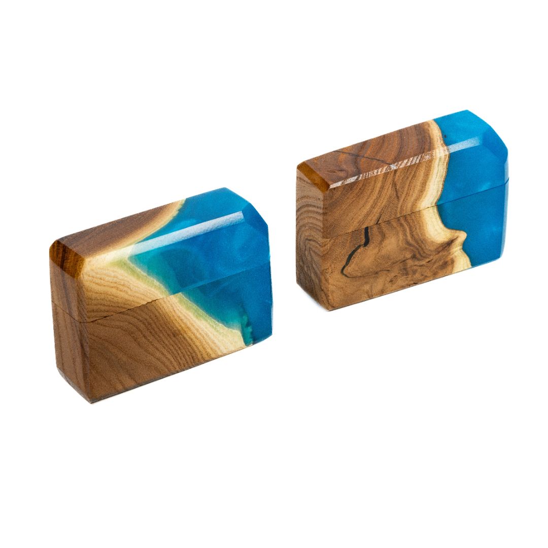 Modern proposal ring box featuring translucent blue epoxy and natural elm wood shown from the side