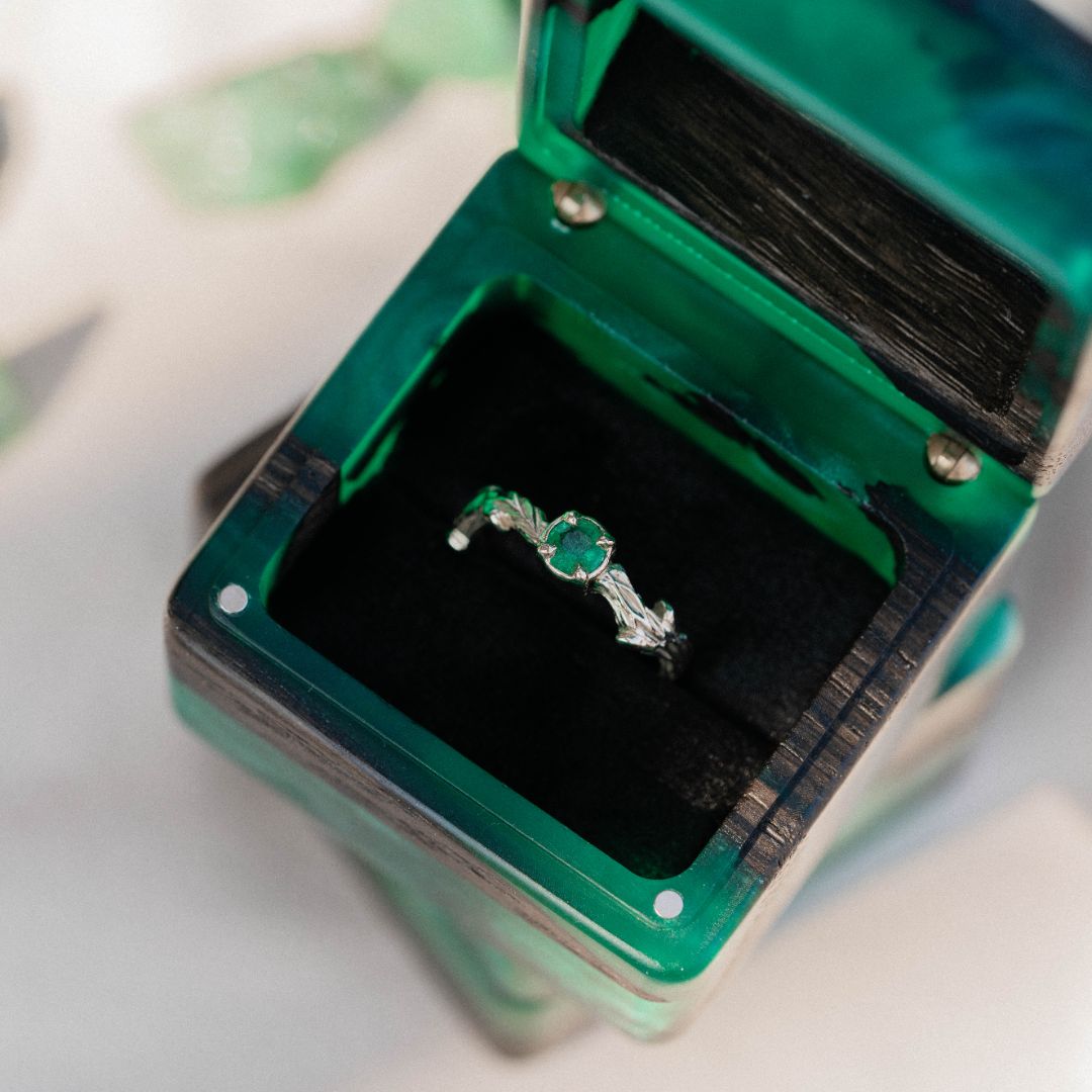 Close-up of the open green epoxy and bog oak wood engagement ring box interior