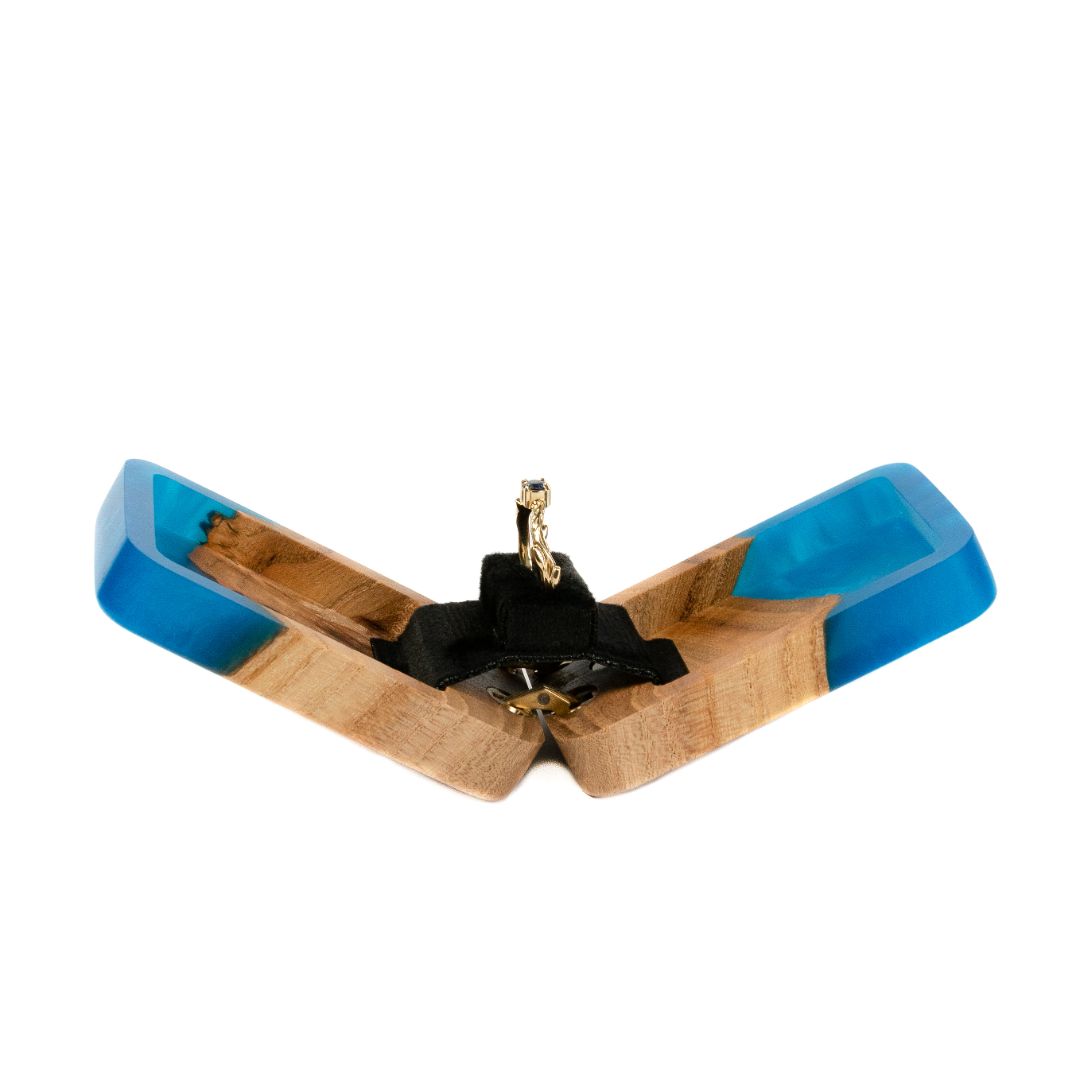 Side profile of the open blue epoxy and elm wood proposal ring box