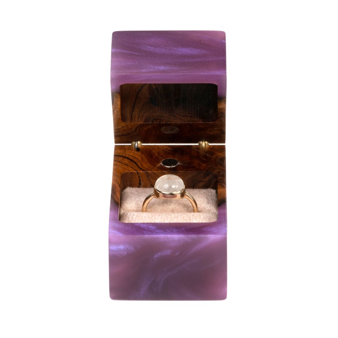 Top view of the open purple epoxy and elm wood engagement ring box showcasing the ring compartment