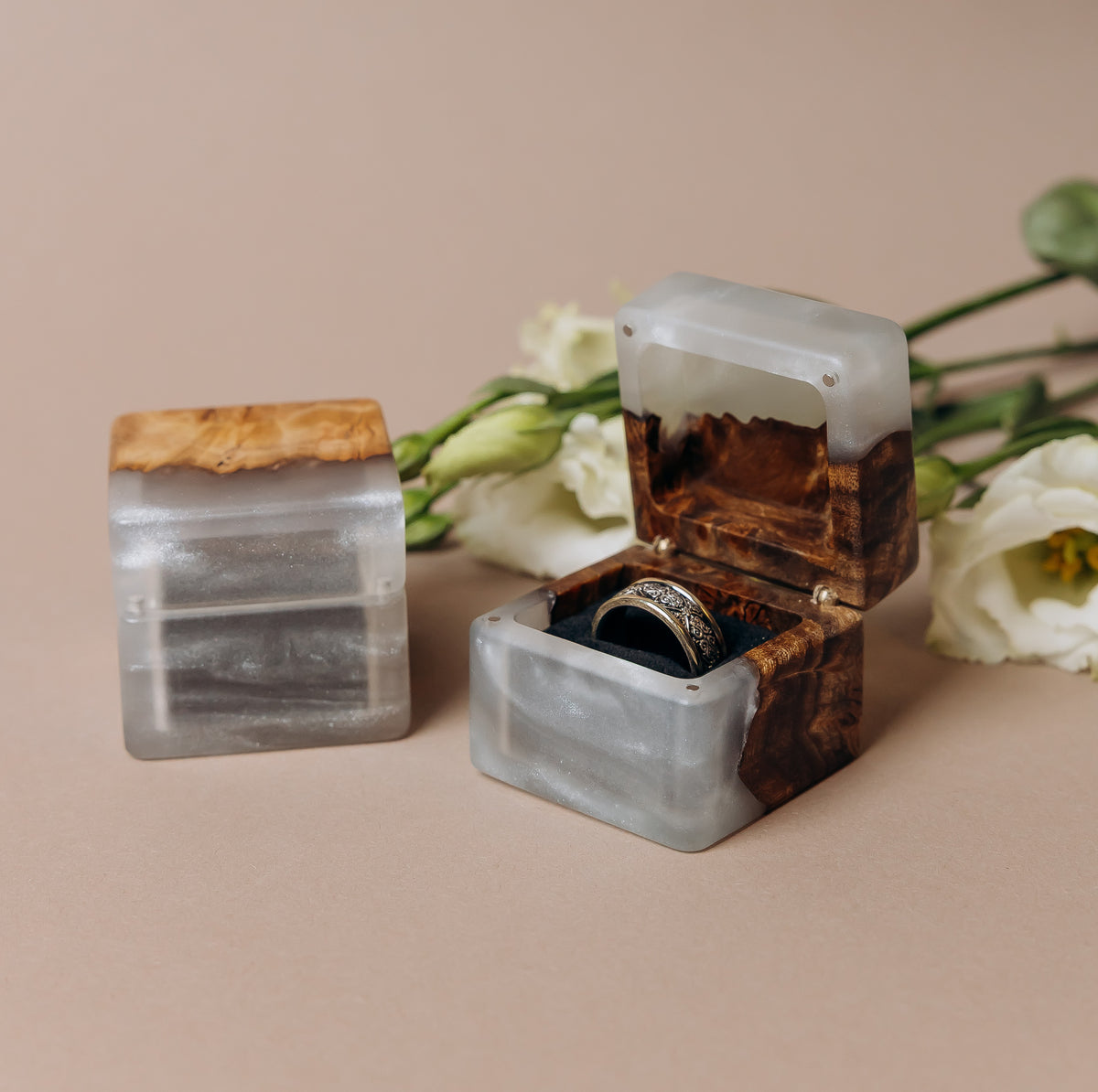 Engagement ring box in platinum epoxy and elm wood, one closed and one open with a ring