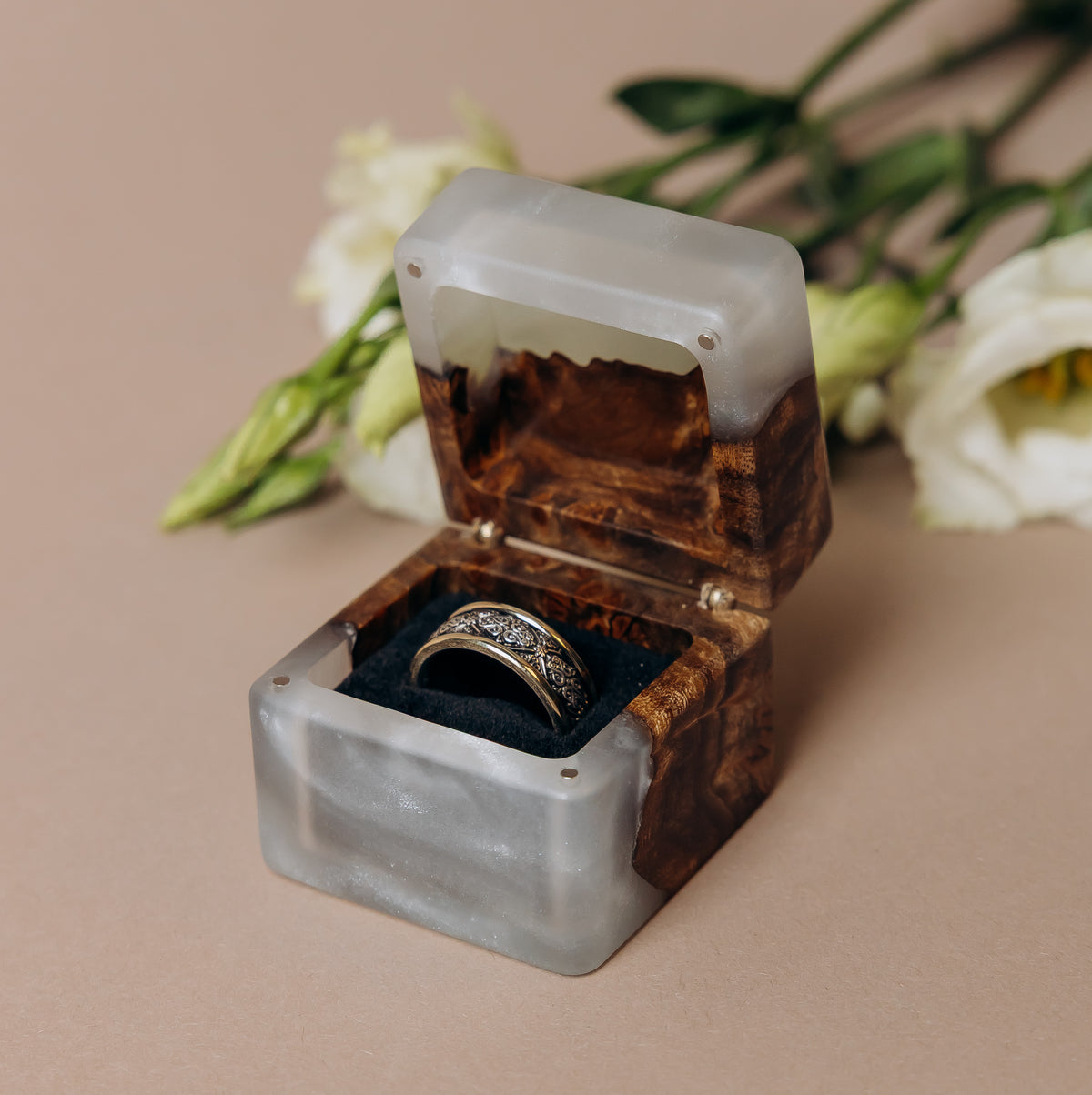 Open platinum epoxy and elm wood engagement ring box holding a diamond band, MUSE design