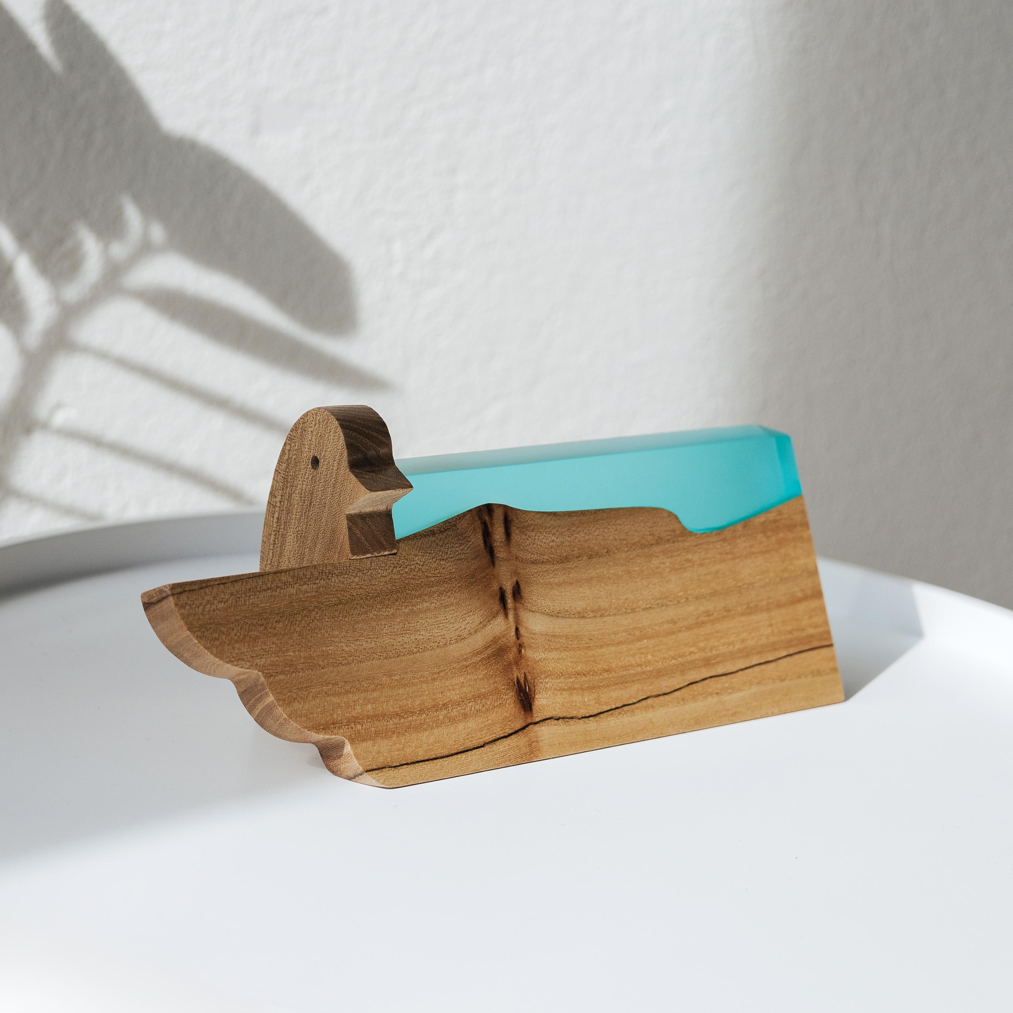 Front view of the personalized BIRDY desk name plate made from elm wood and aqua blue epoxy resin