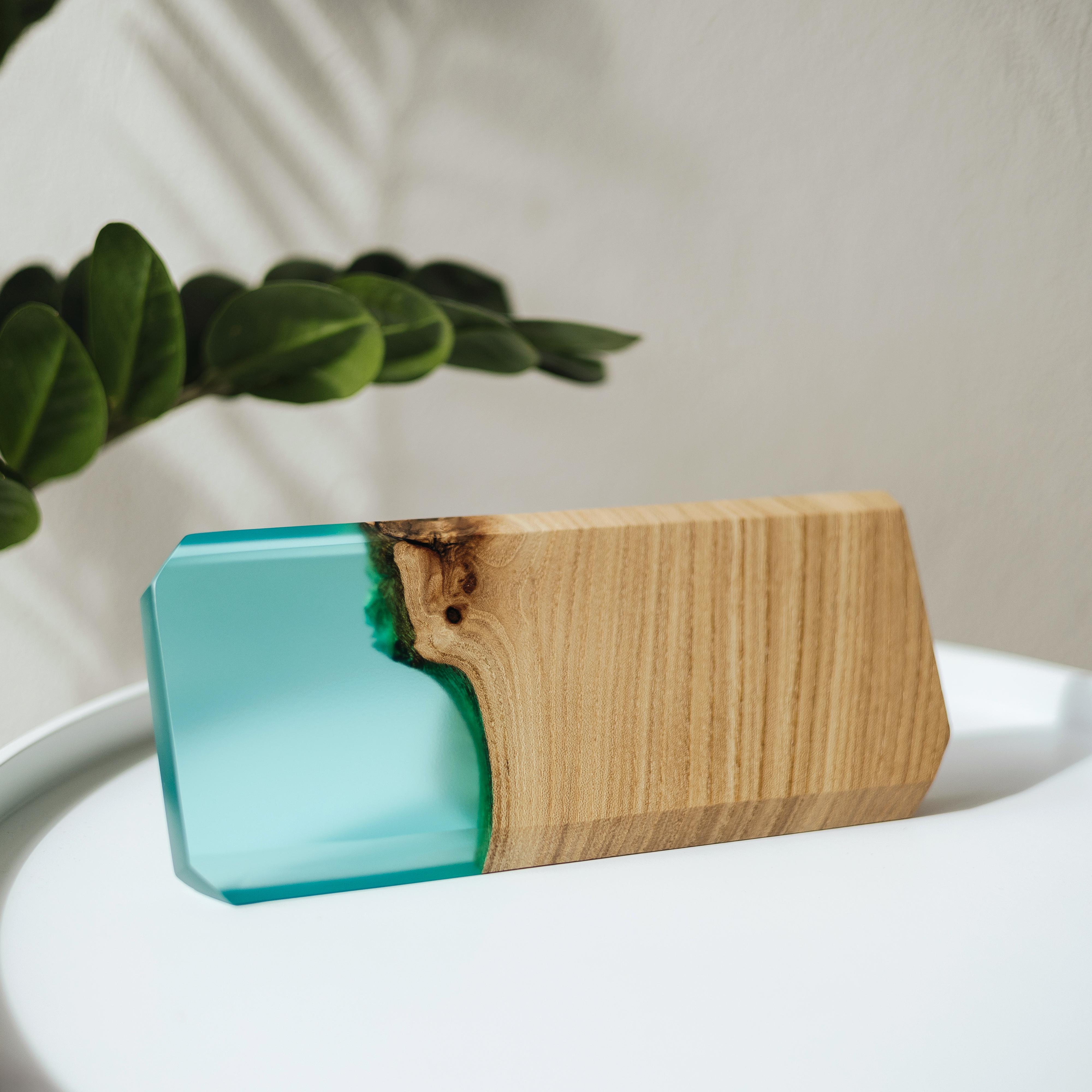 Angled view of the personalized MODERN desk name plate handcrafted from elm wood and aqua blue epoxy resin