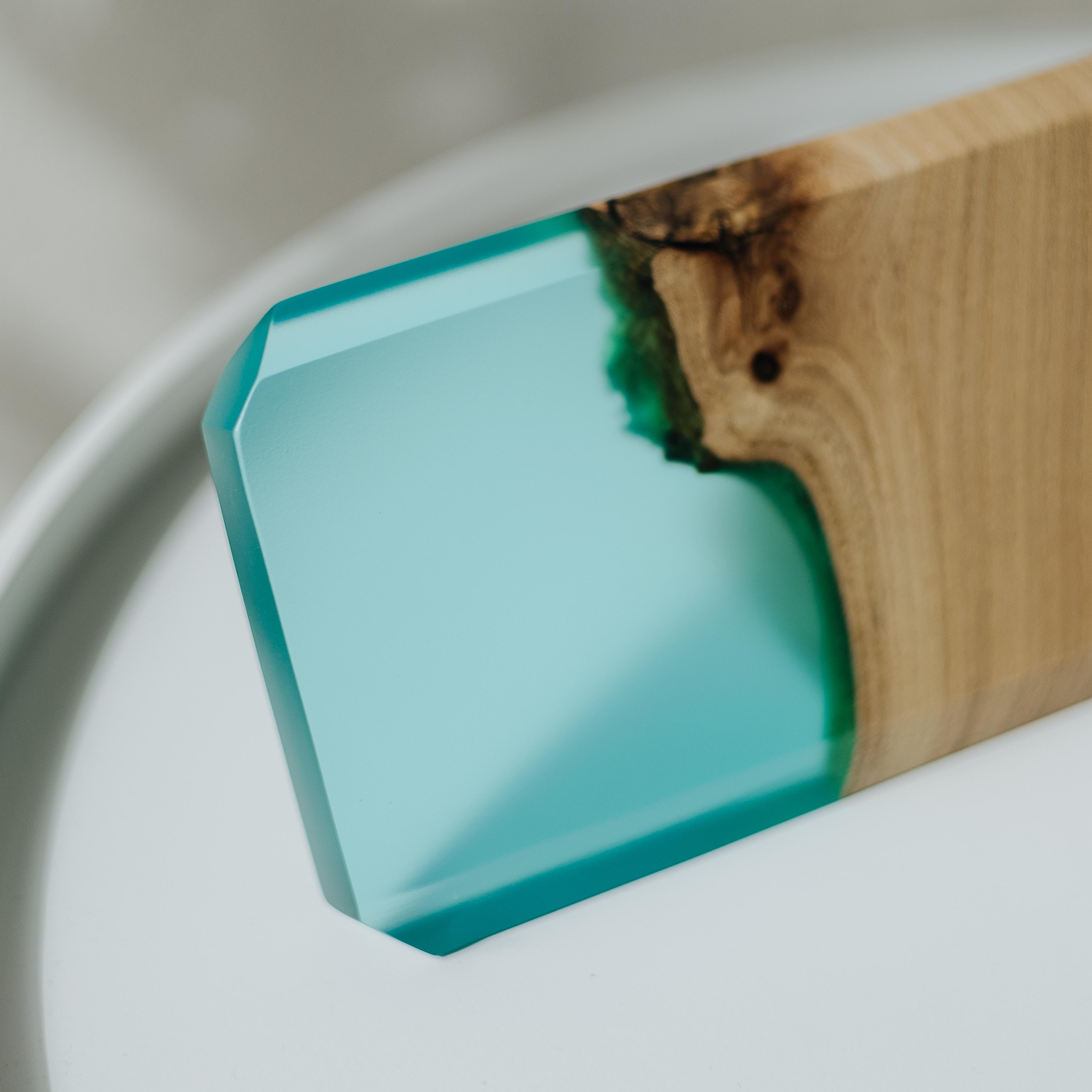 Close-up of the personalized MODERN desk name plate made from elm wood and aqua blue epoxy resin