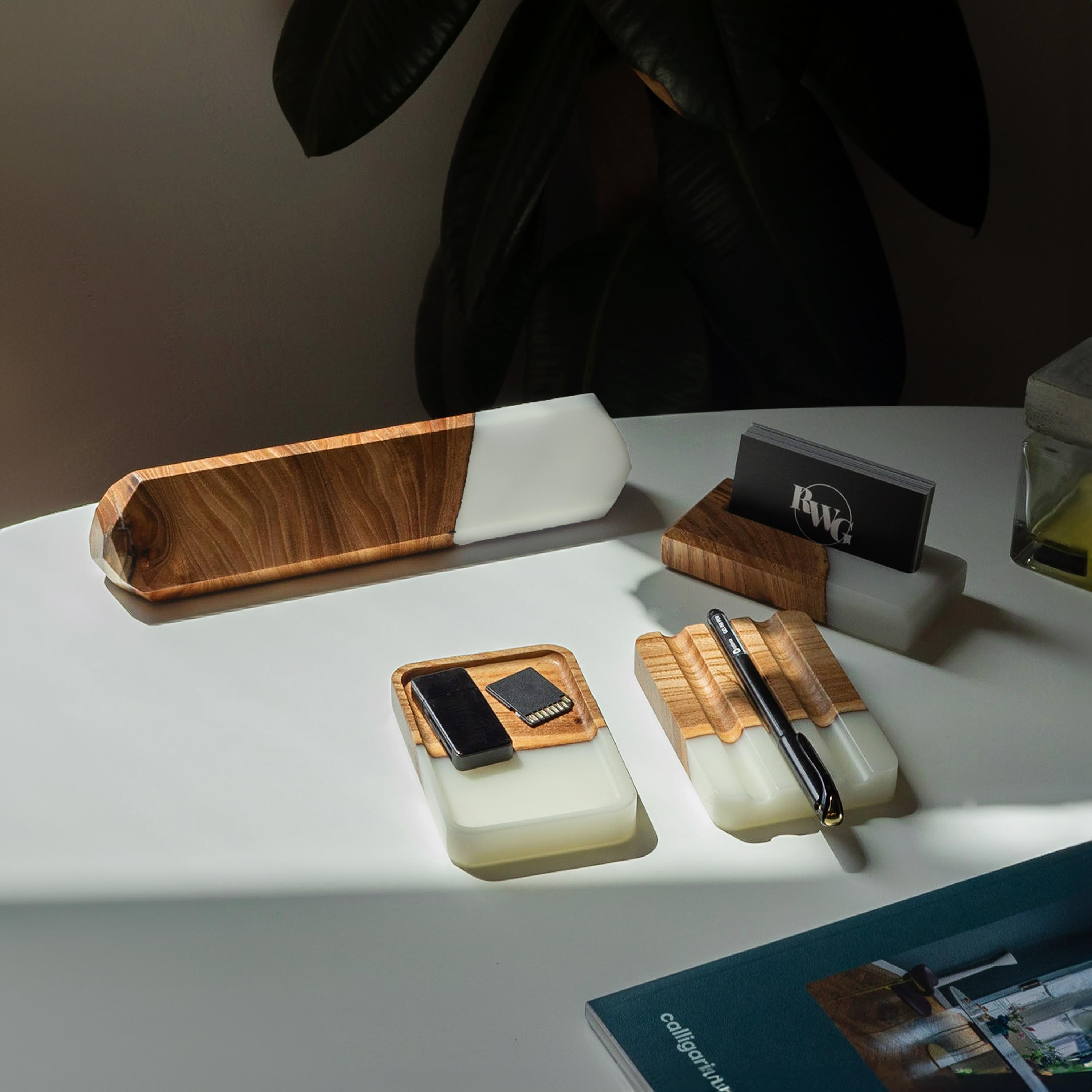 Personalized desk name plate made from elm wood and white epoxy resin displayed in a modern office setting