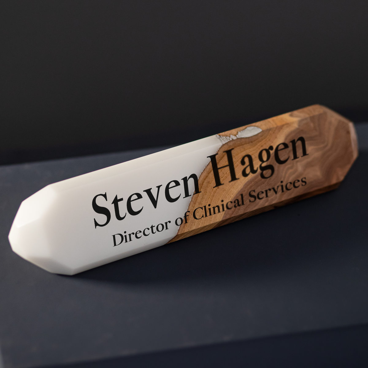 Custom desk name plate in white epoxy and elm engraved for a director of clinical services