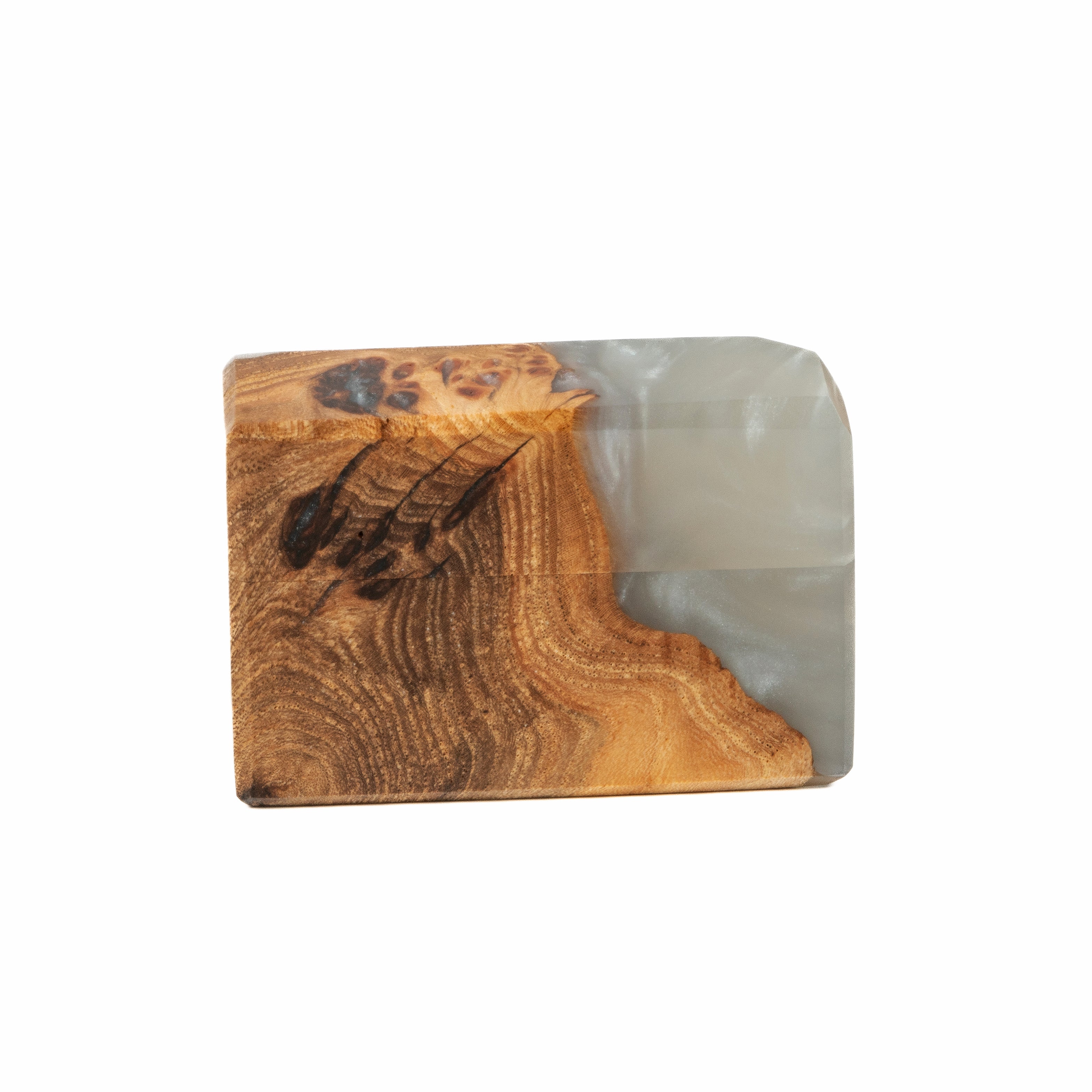 Modern platinum epoxy and elm wood engagement ring box displayed in a minimalist studio setting