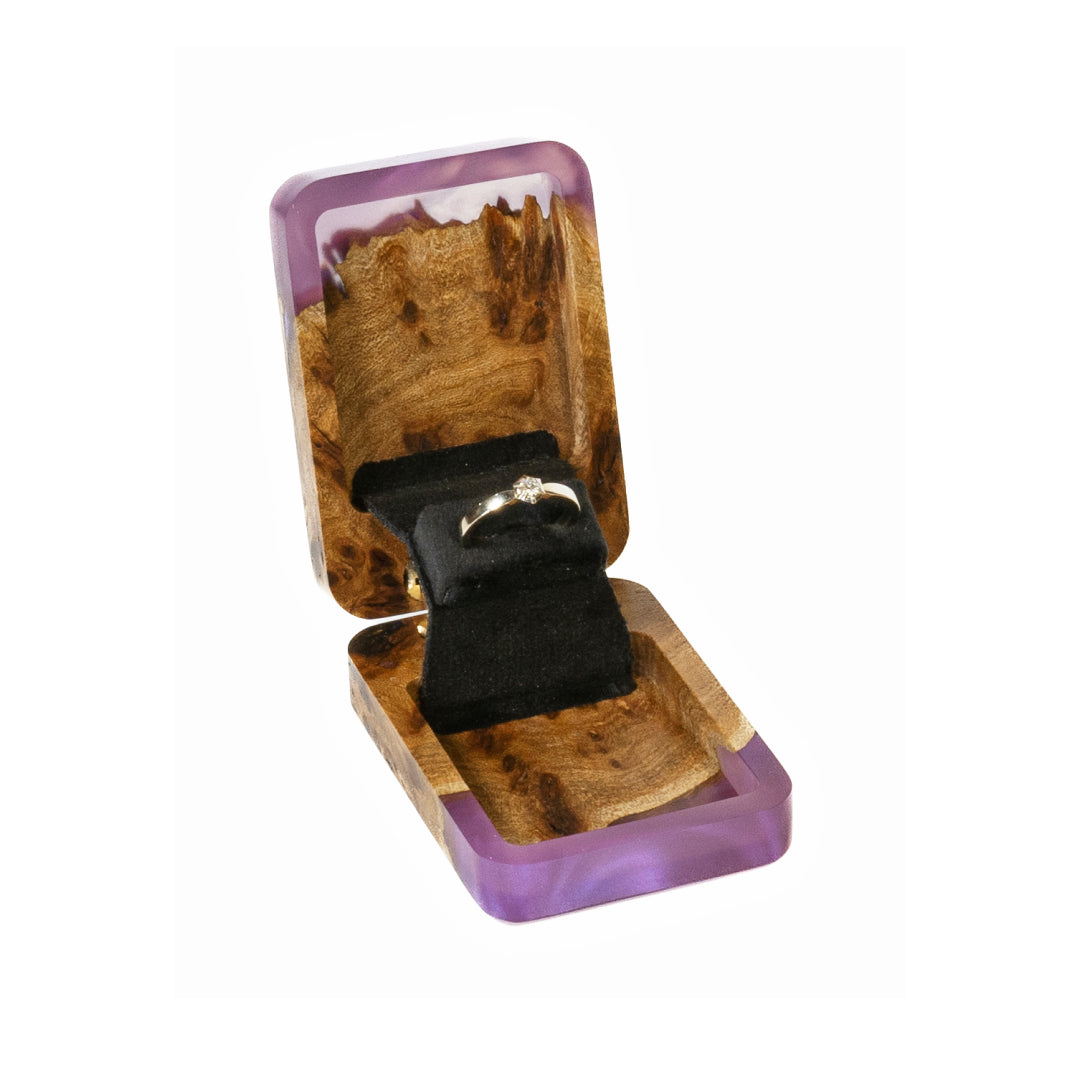 Elegant open purple epoxy and elm wood engagement ring box with soft studio lighting