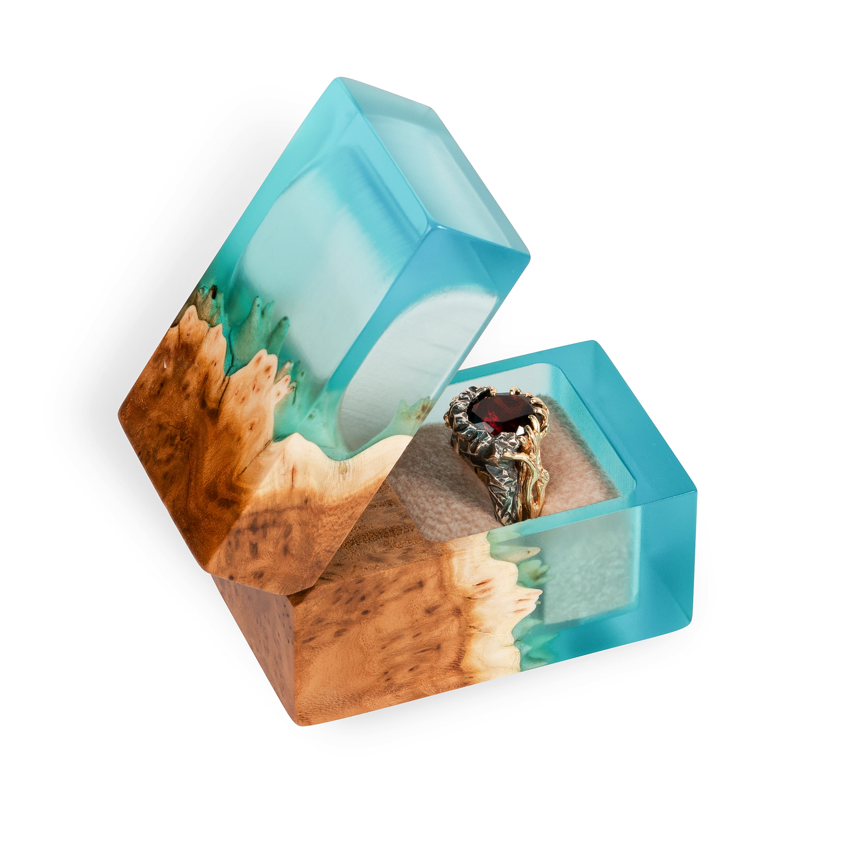 Angled view of the open aqua blue epoxy and elm wood proposal ring box with ring inside