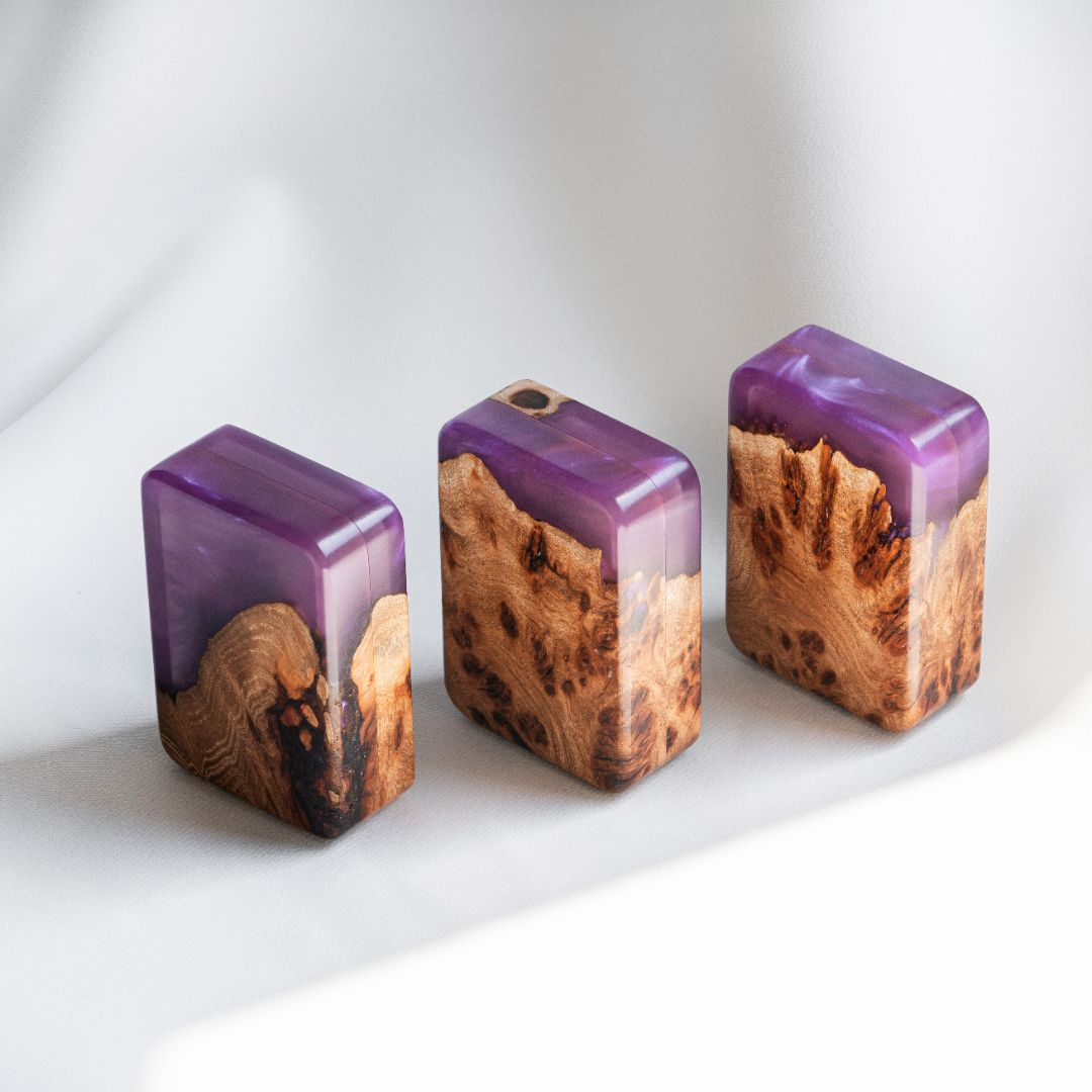 Three handcrafted purple epoxy and elm wood engagement ring boxes from different angles