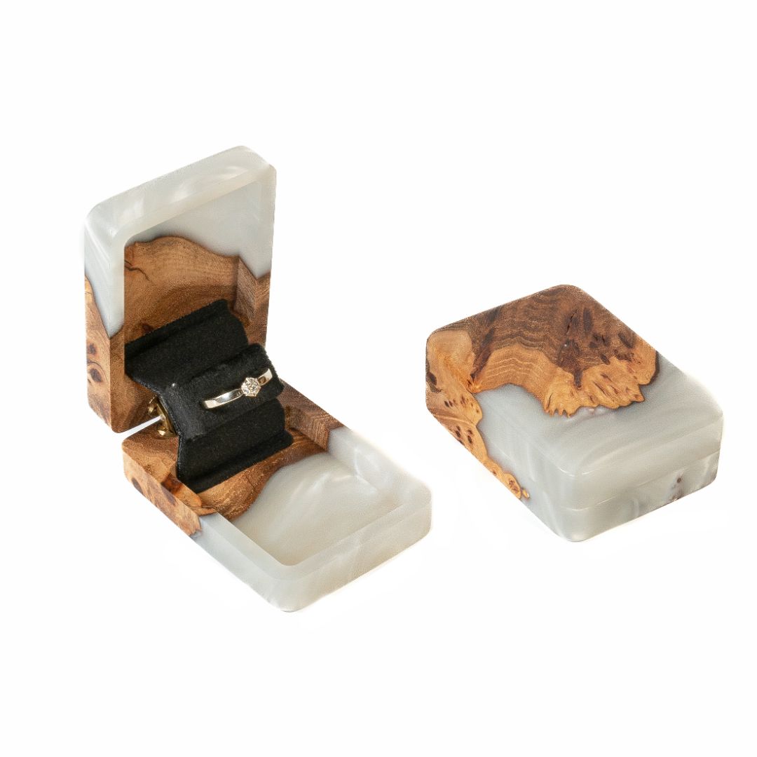 Handcrafted platinum epoxy and elm wood proposal ring box photographed from a front angle