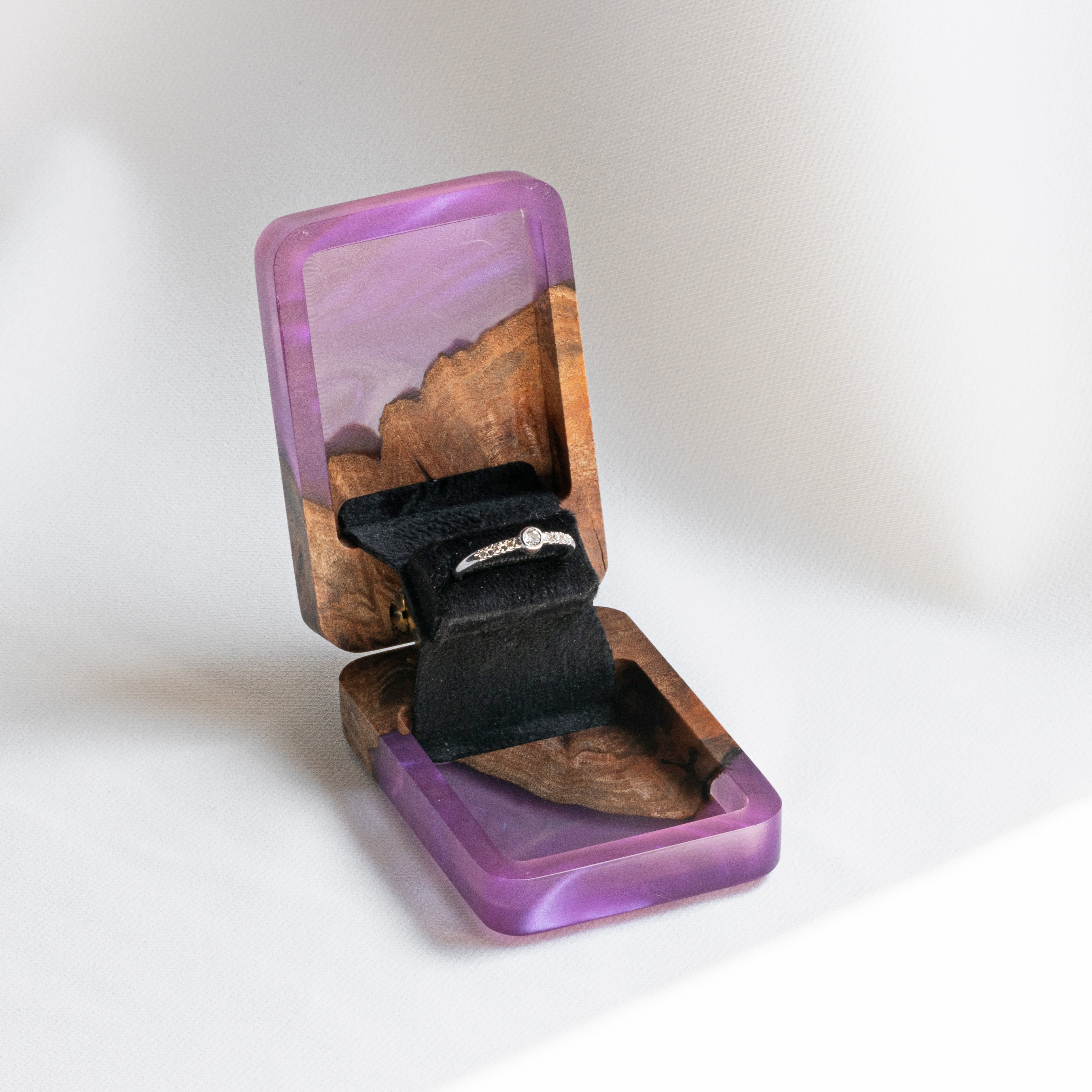 Luxury purple epoxy and elm wood engagement ring box displayed open on a white background