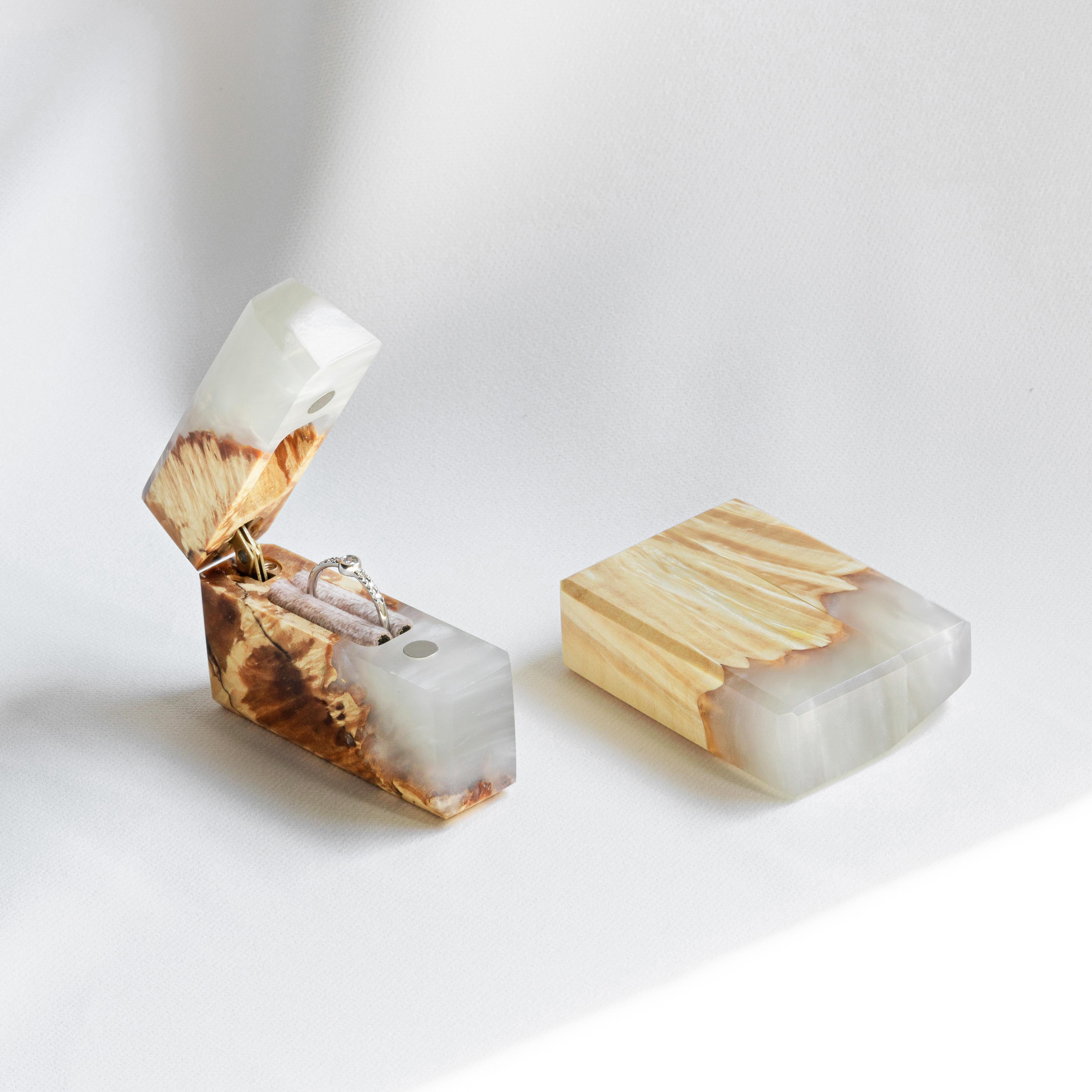 Open platinum epoxy and maple wood engagement ring box displayed beside the matching closed lid