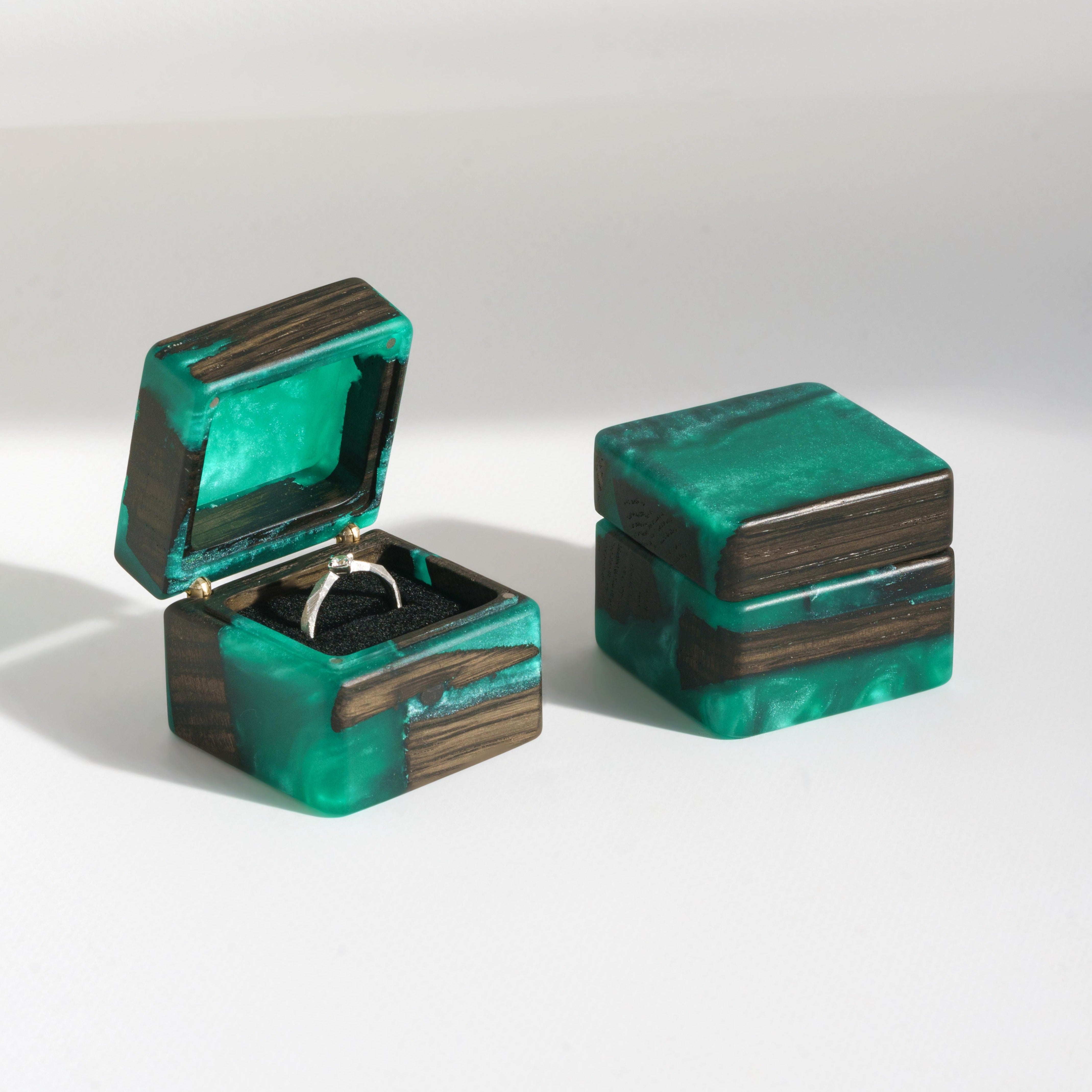 Open and closed engagement ring box crafted from green epoxy and bog oak wood, MUSE design