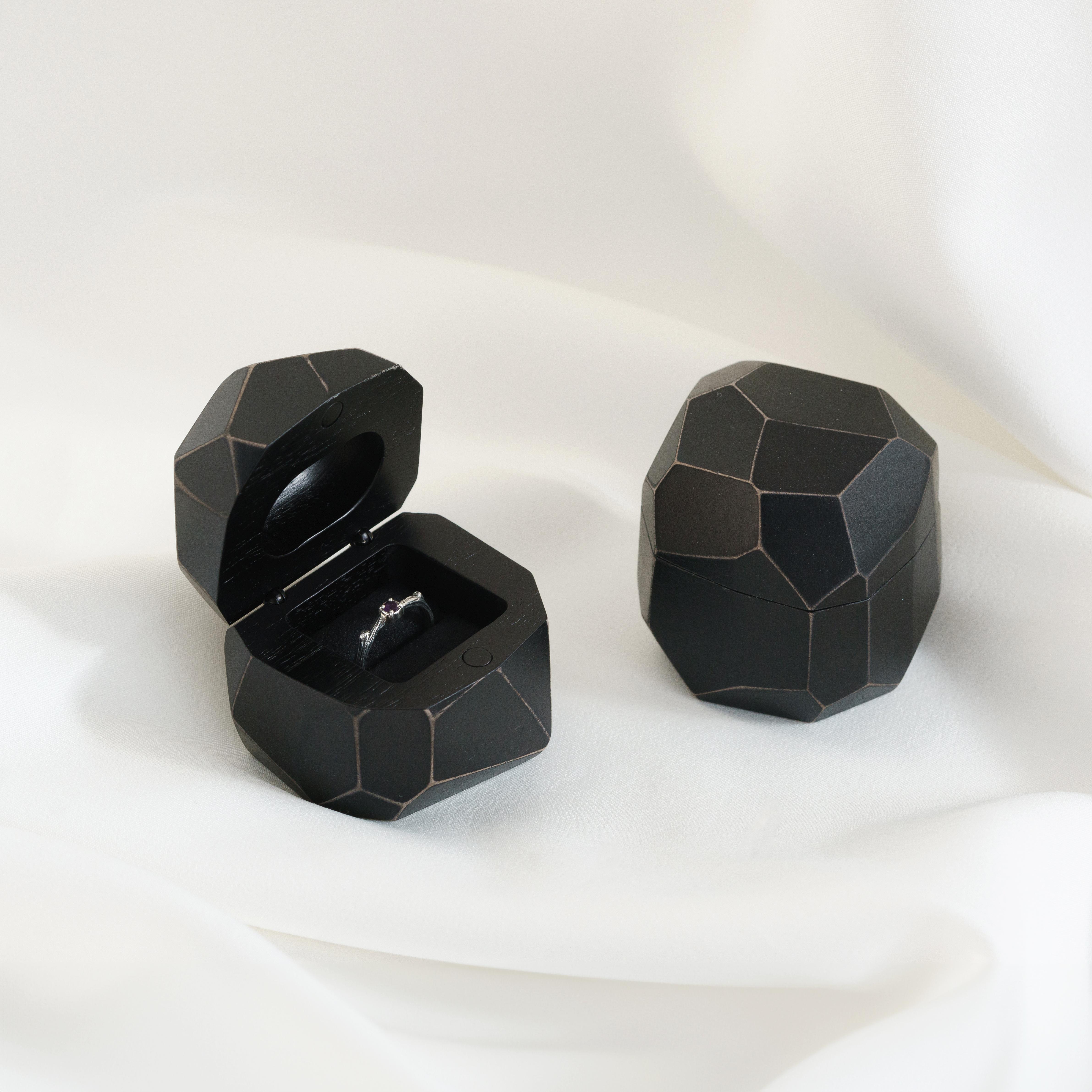 Open proposal ring box handcrafted from black epoxy and bog oak wood with faceted METEORITE design
