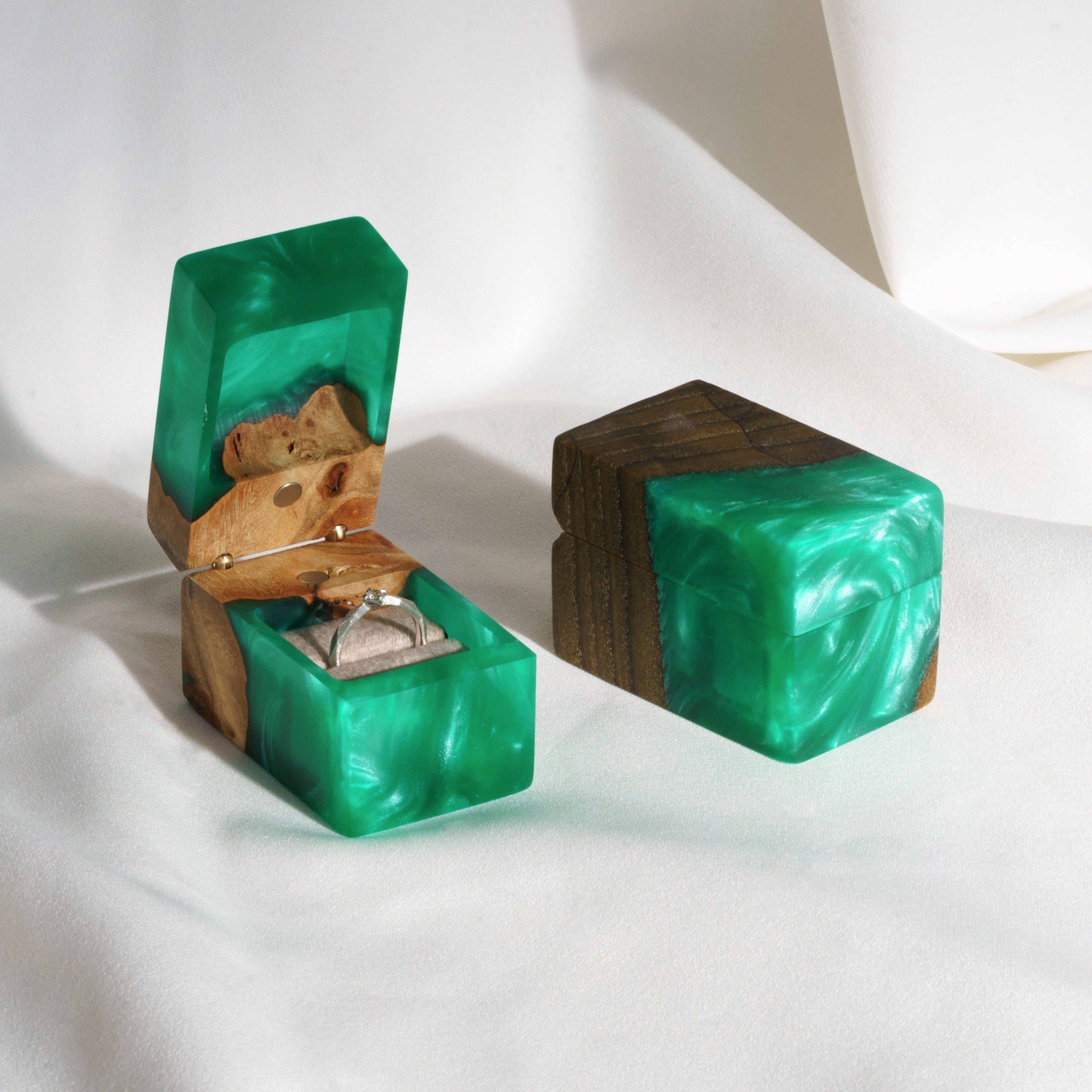 Open proposal ring box handcrafted from green epoxy and elm wood with the matching closed box beside it