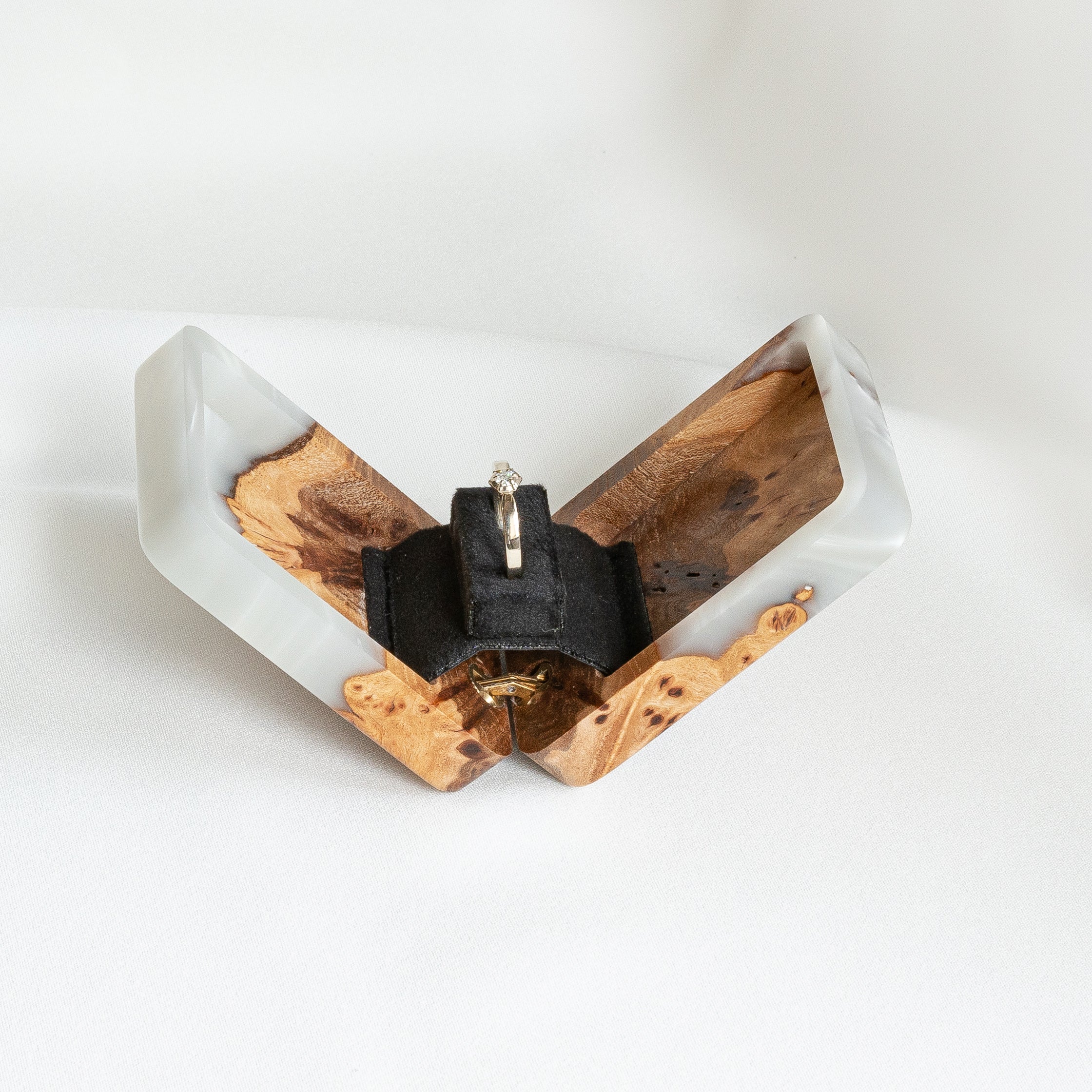 Open platinum epoxy and elm wood proposal ring box displayed with the matching closed lid