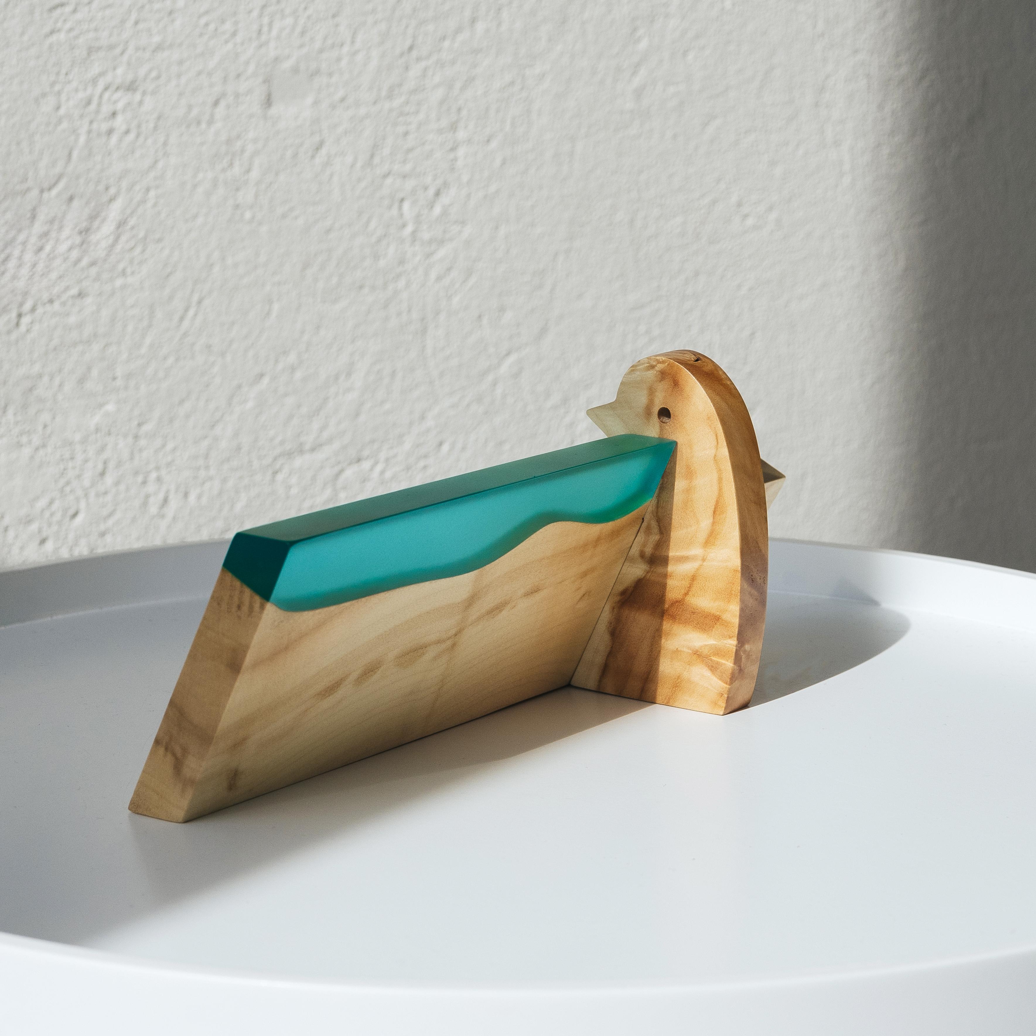 Side view of the personalized BIRDY desk name plate made from maple wood and aqua blue epoxy resin