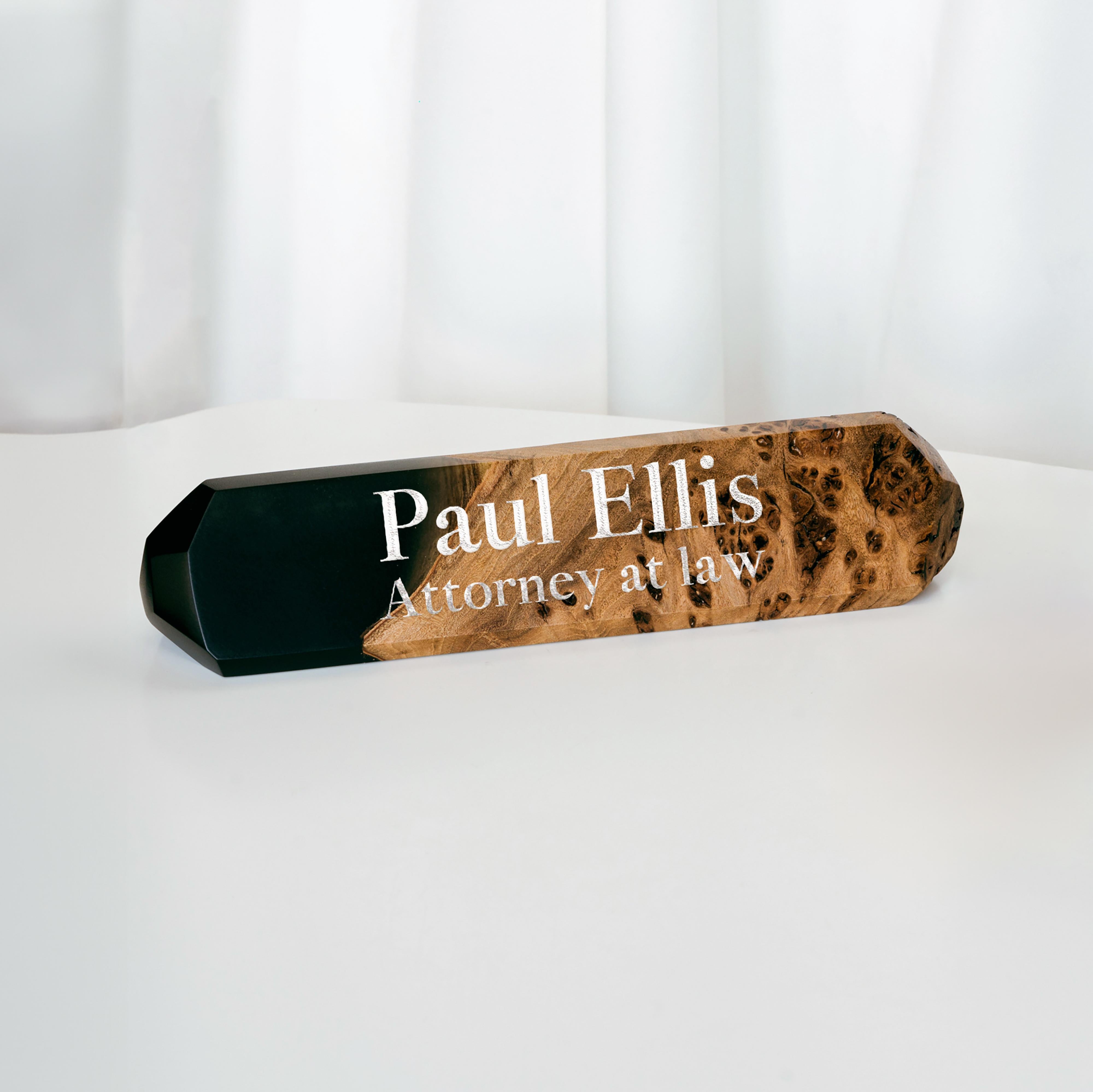 Personalized desk name plate handcrafted from burl wood and black epoxy resin displayed on an office desk