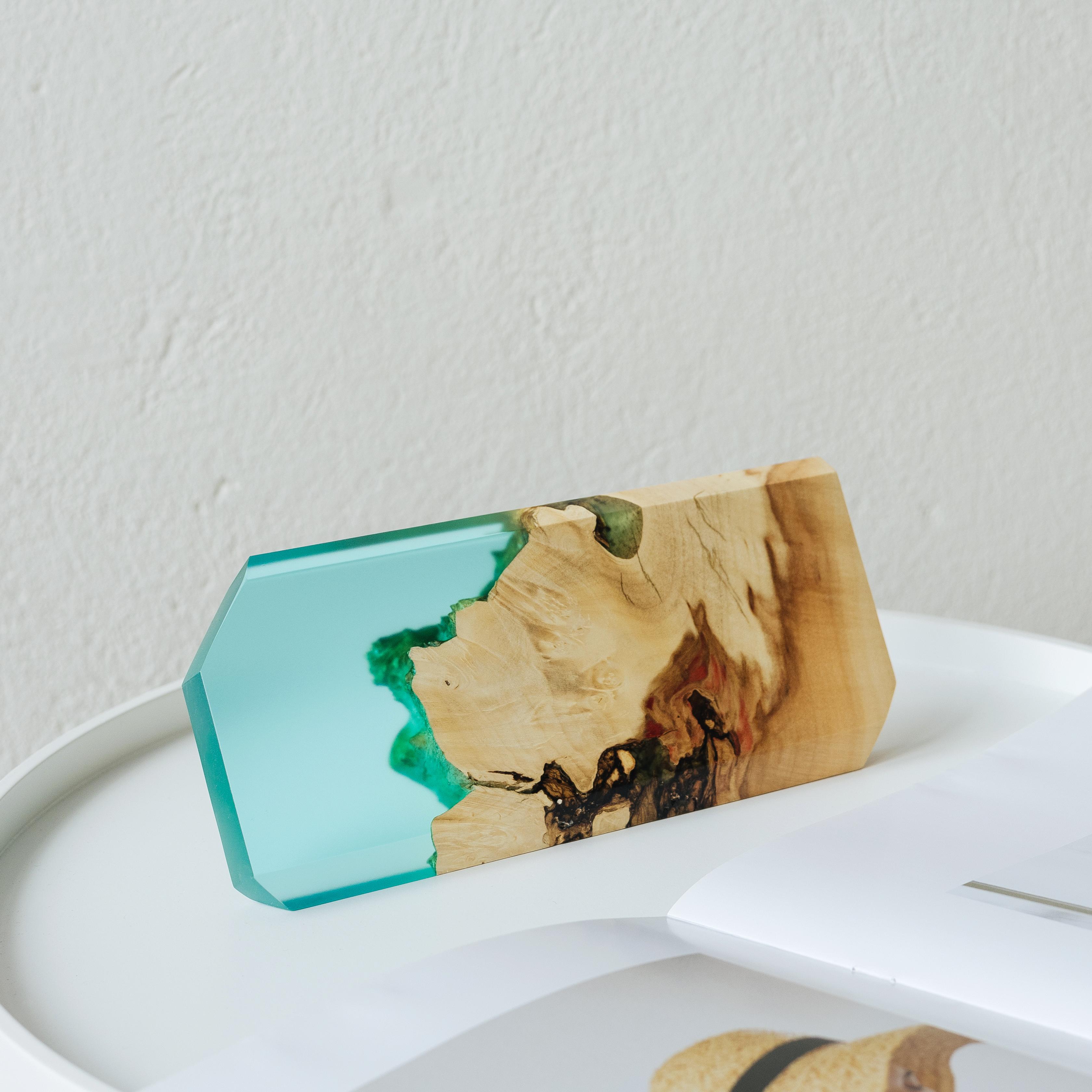 Angled view of the personalized MODERN desk name plate handcrafted from maple wood and aqua blue epoxy resin