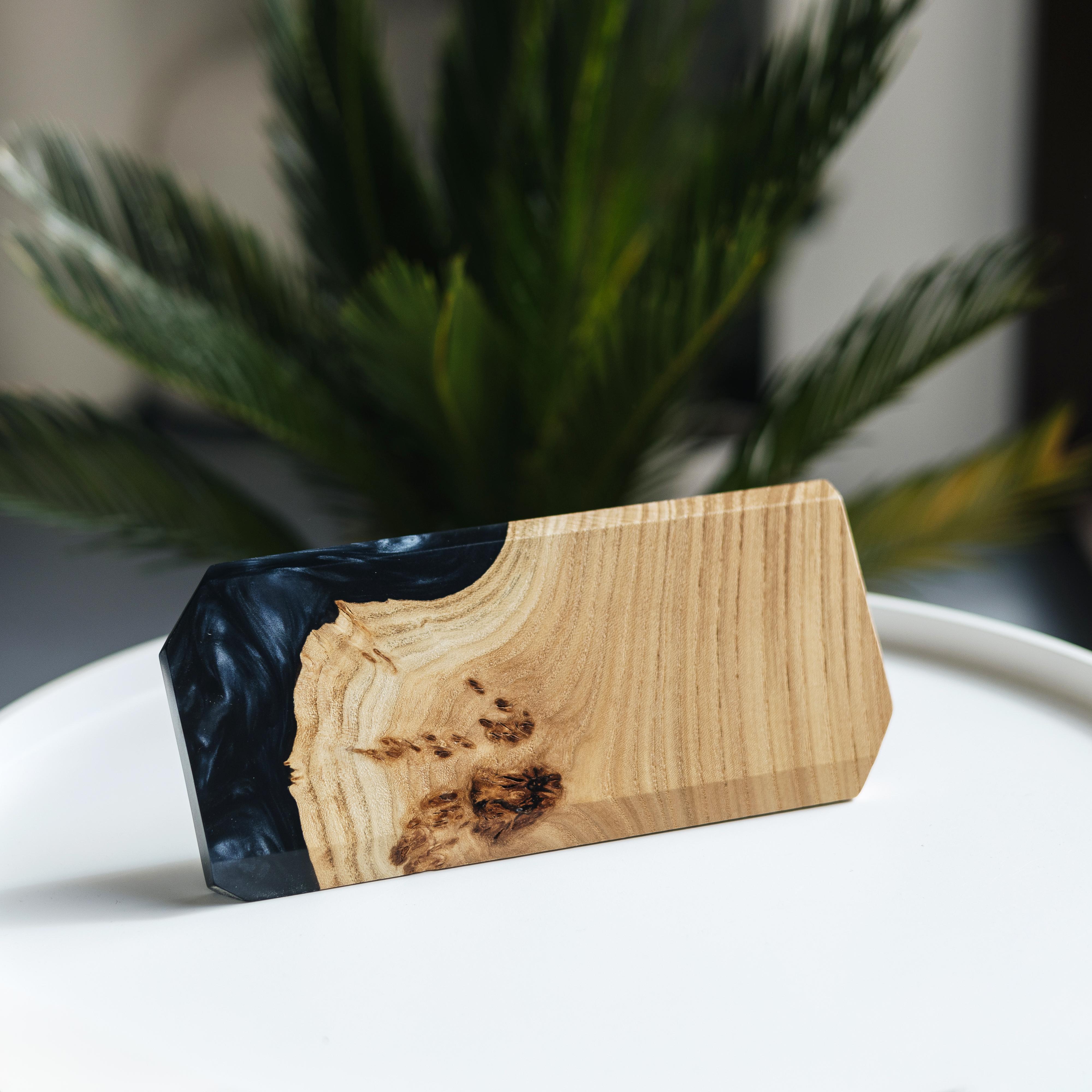Angled view of the personalized MODERN desk name plate handcrafted from elm wood and black epoxy resin